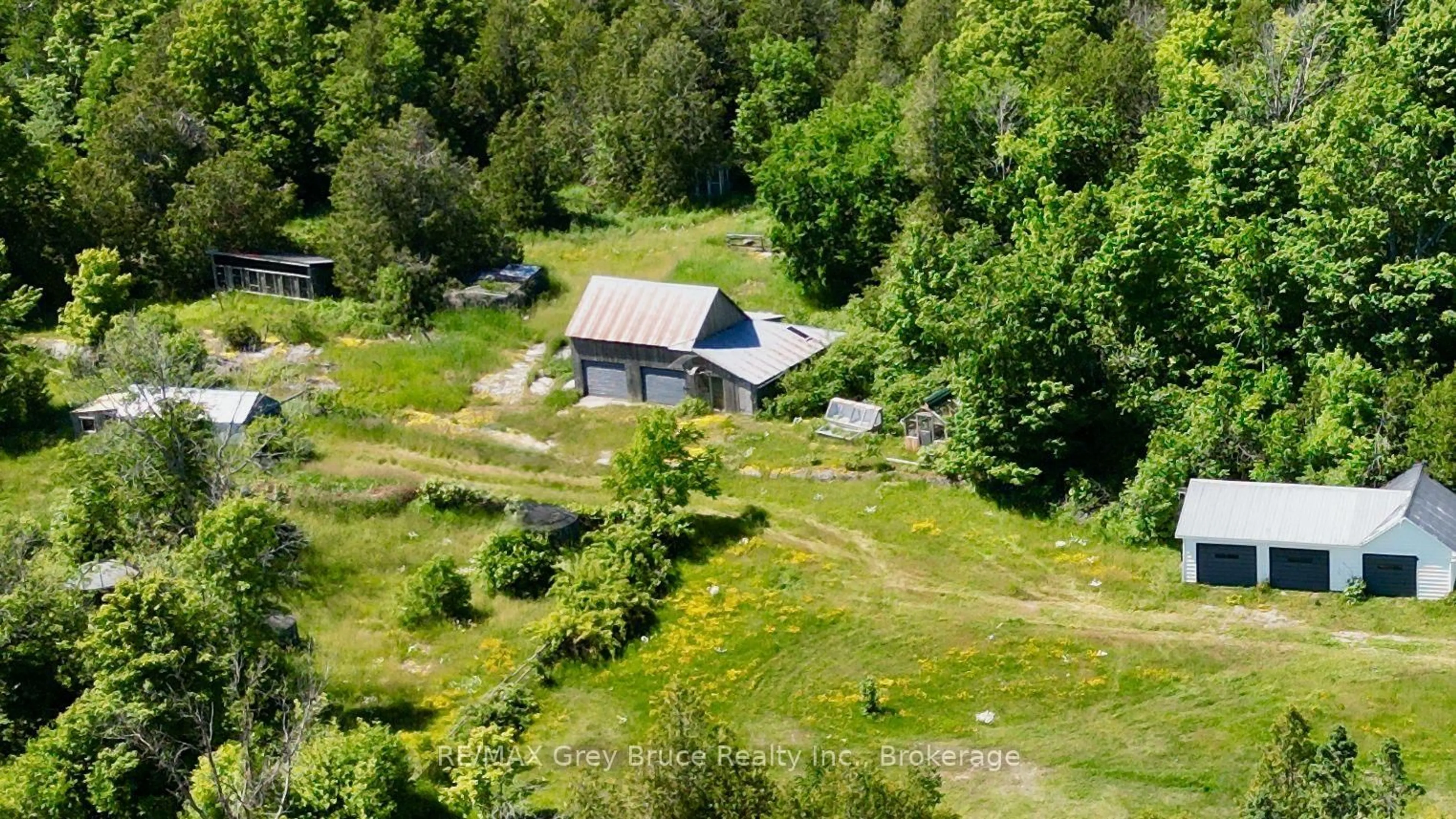 A pic from outside/outdoor area/front of a property/back of a property/a pic from drone, unknown for 43 Bartley Dr, Northern Bruce Peninsula Ontario N0H 1Z0