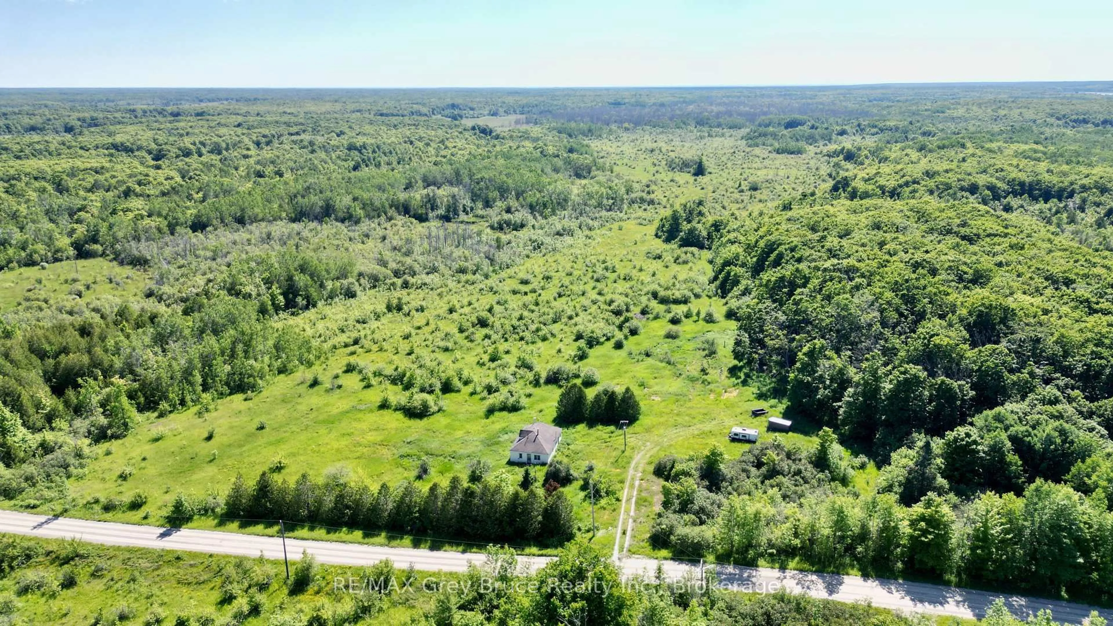 A pic from outside/outdoor area/front of a property/back of a property/a pic from drone, forest/trees view for 151 BARTLEY Dr, Northern Bruce Peninsula Ontario N0H 1W0