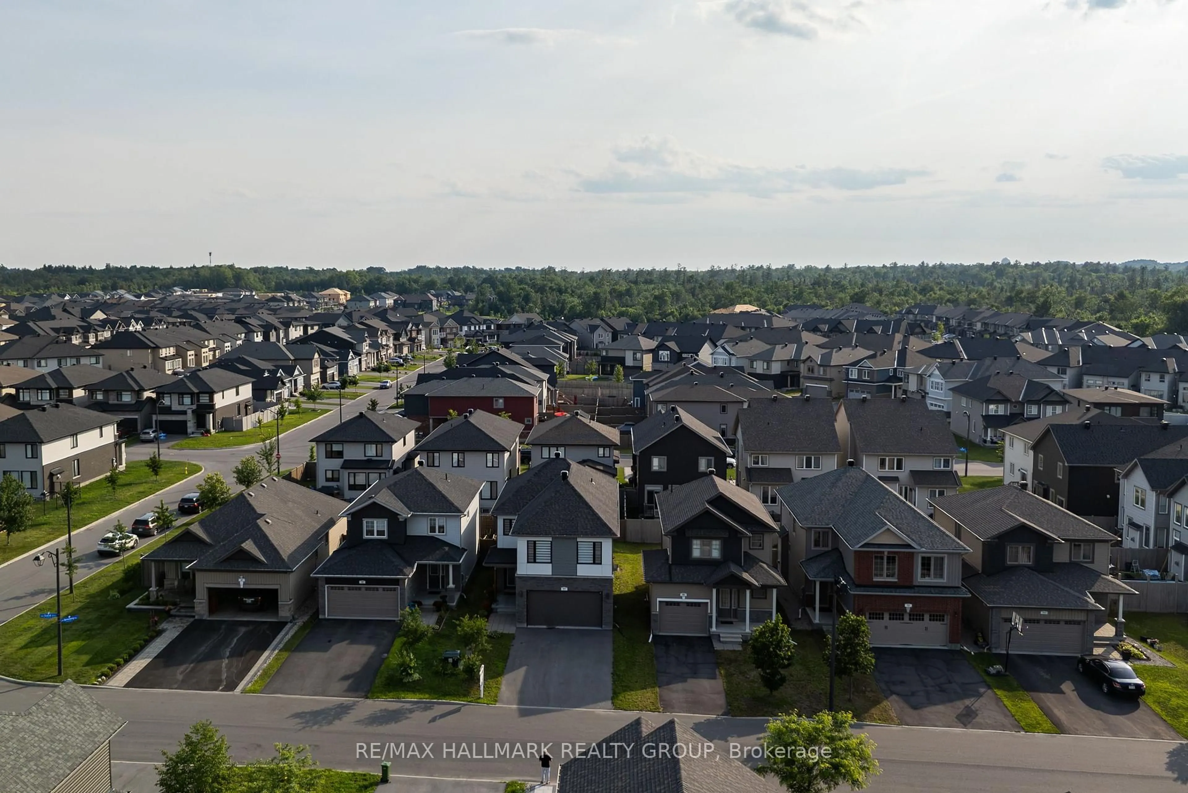 A pic from outside/outdoor area/front of a property/back of a property/a pic from drone, unknown for 57 Zaatiik Grve, Ottawa Ontario K1X 0E5