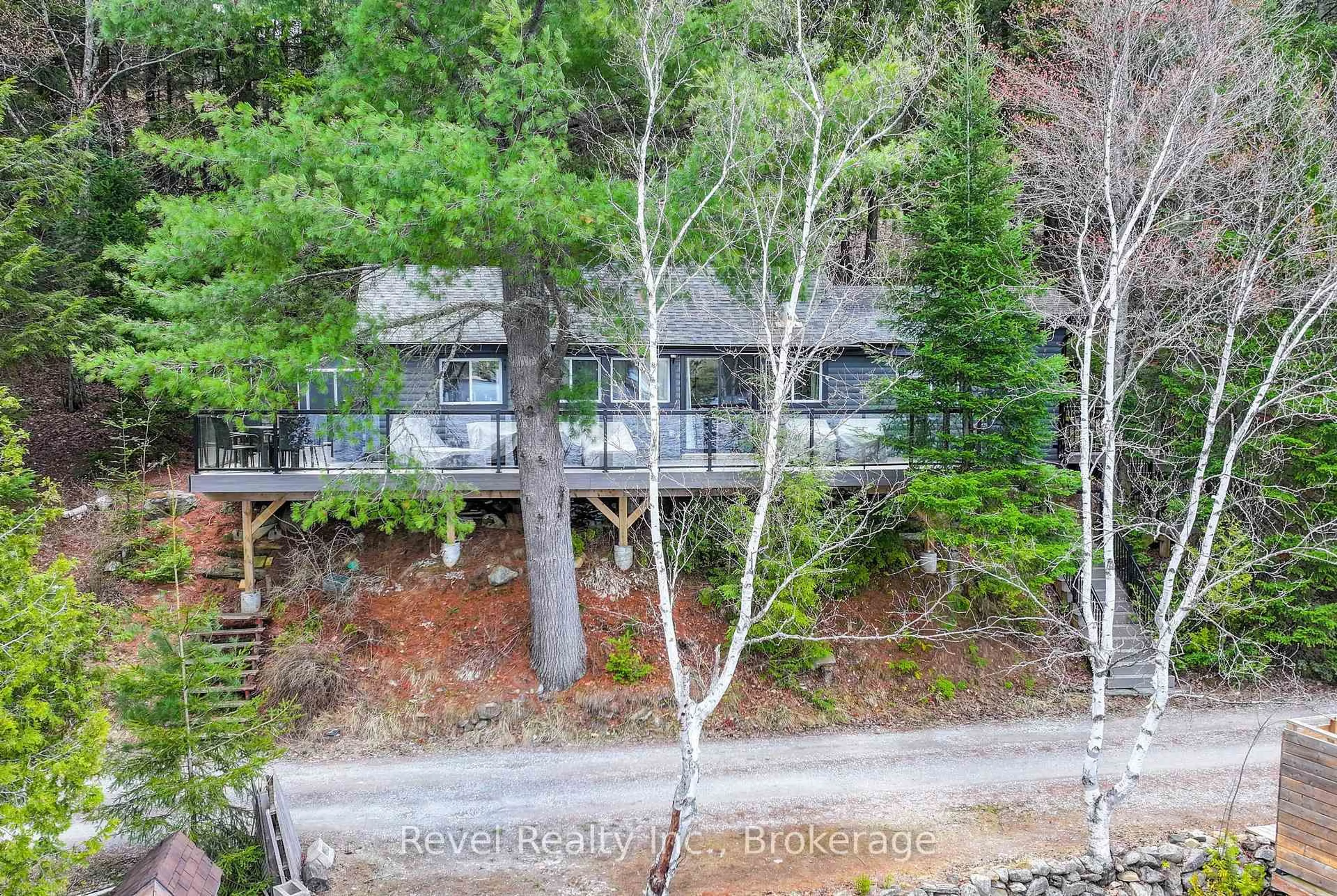 A pic from outside/outdoor area/front of a property/back of a property/a pic from drone, forest/trees view for 1129 LAKESHORE Rd, Highlands East Ontario K0M 1R0
