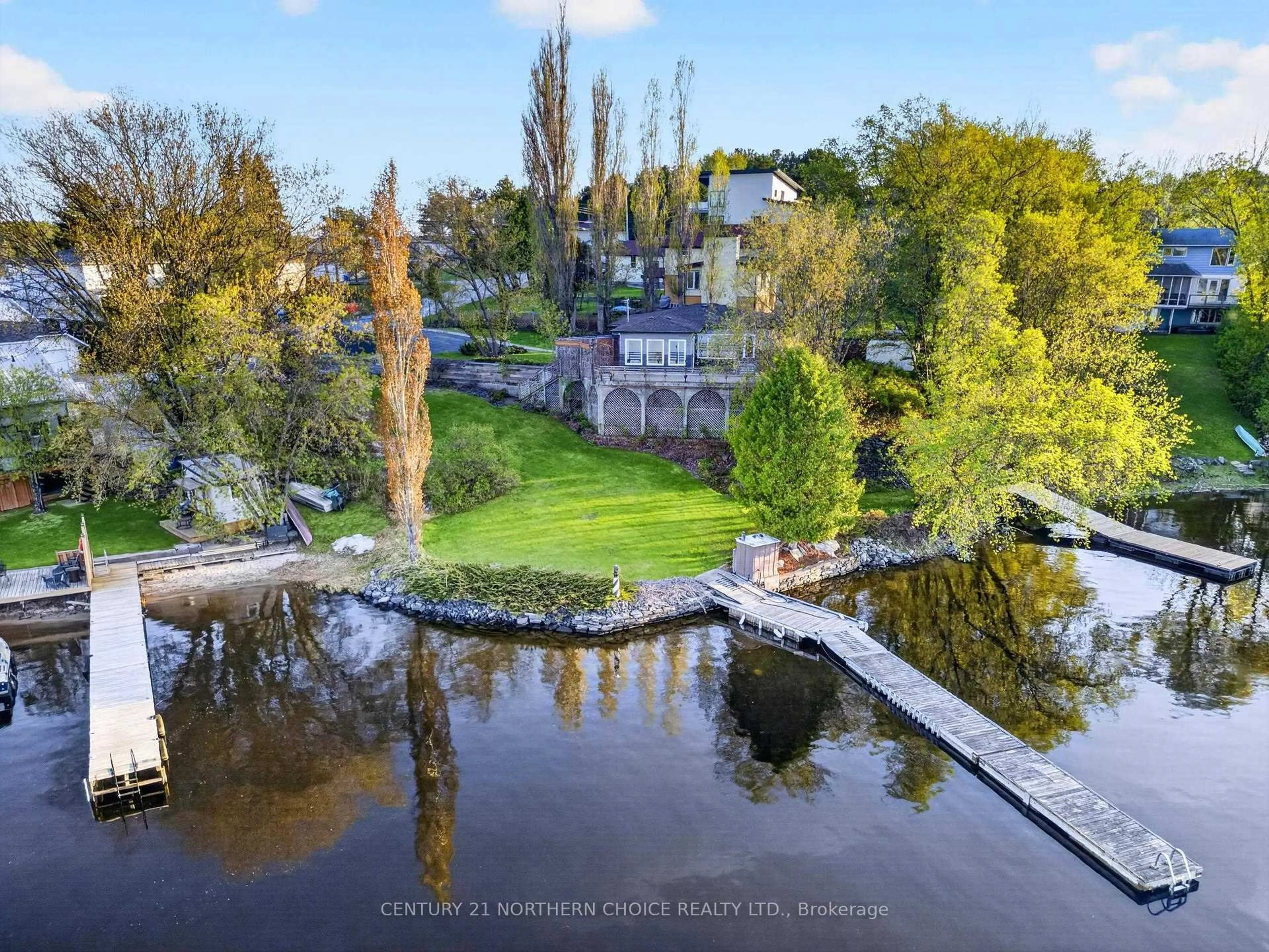 A pic from outside/outdoor area/front of a property/back of a property/a pic from drone, water/lake/river/ocean view for 8 Minnesota Street, Kenora Ontario P9N 3P2