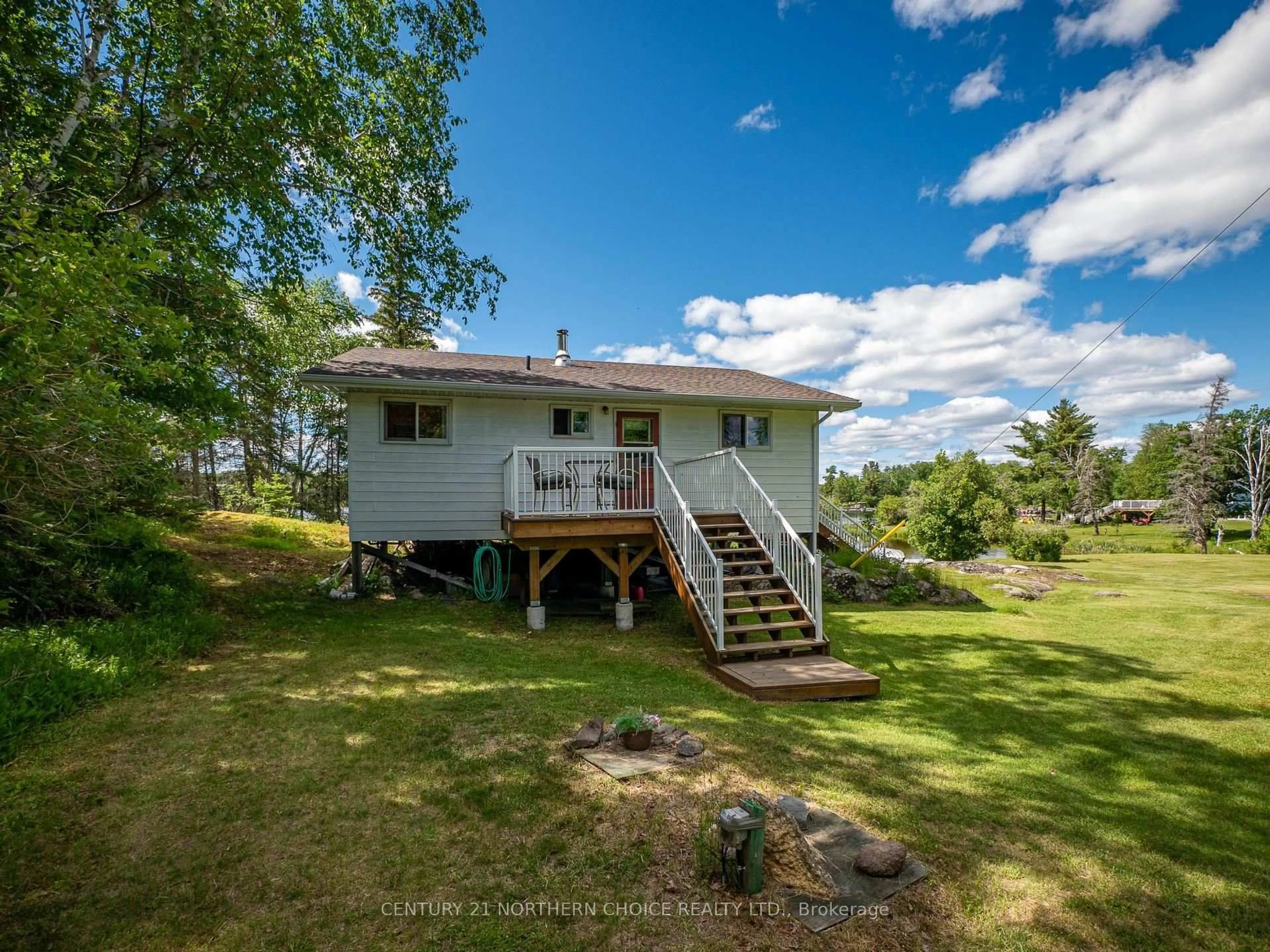 A pic from outside/outdoor area/front of a property/back of a property/a pic from drone, water/lake/river/ocean view for 440 Coney Island, Kenora Ontario P9N 3X4