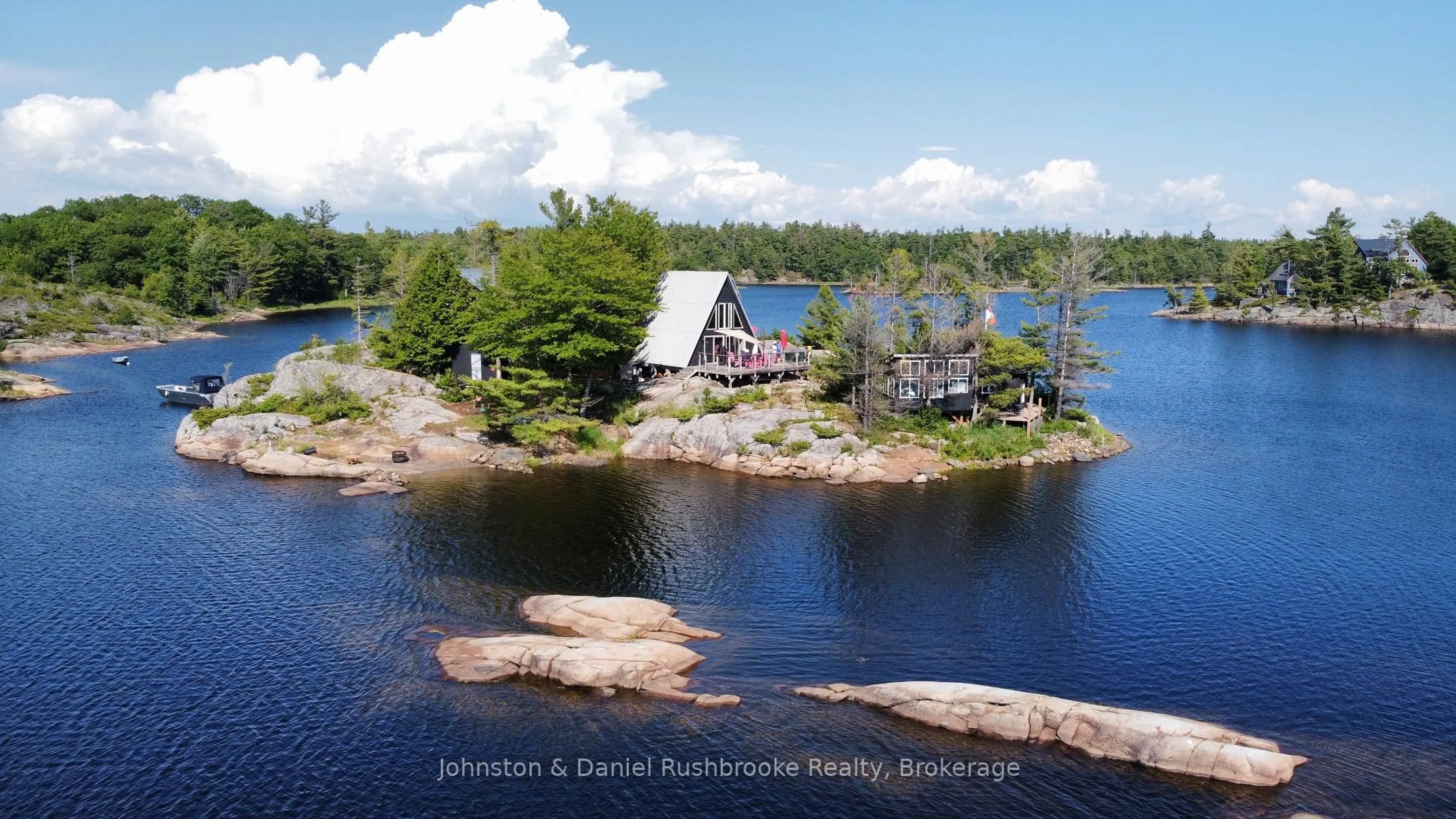 A pic from outside/outdoor area/front of a property/back of a property/a pic from drone, water/lake/river/ocean view for 1 B244 (Conger) Island, The Archipelago Ontario P2A 1T0