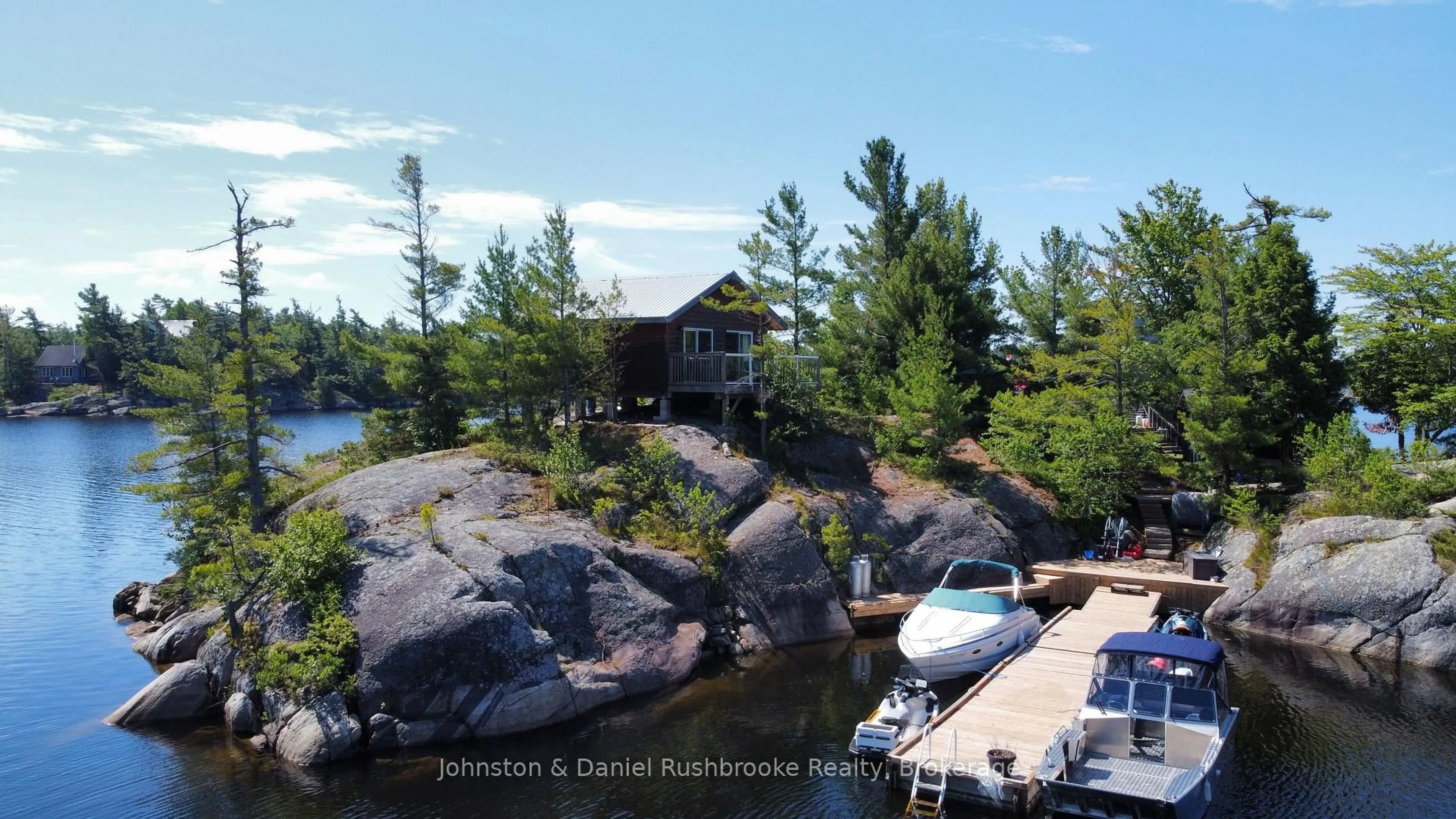 A pic from outside/outdoor area/front of a property/back of a property/a pic from drone, water/lake/river/ocean view for 1 B244 (Conger) Island, The Archipelago Ontario P2A 1T0