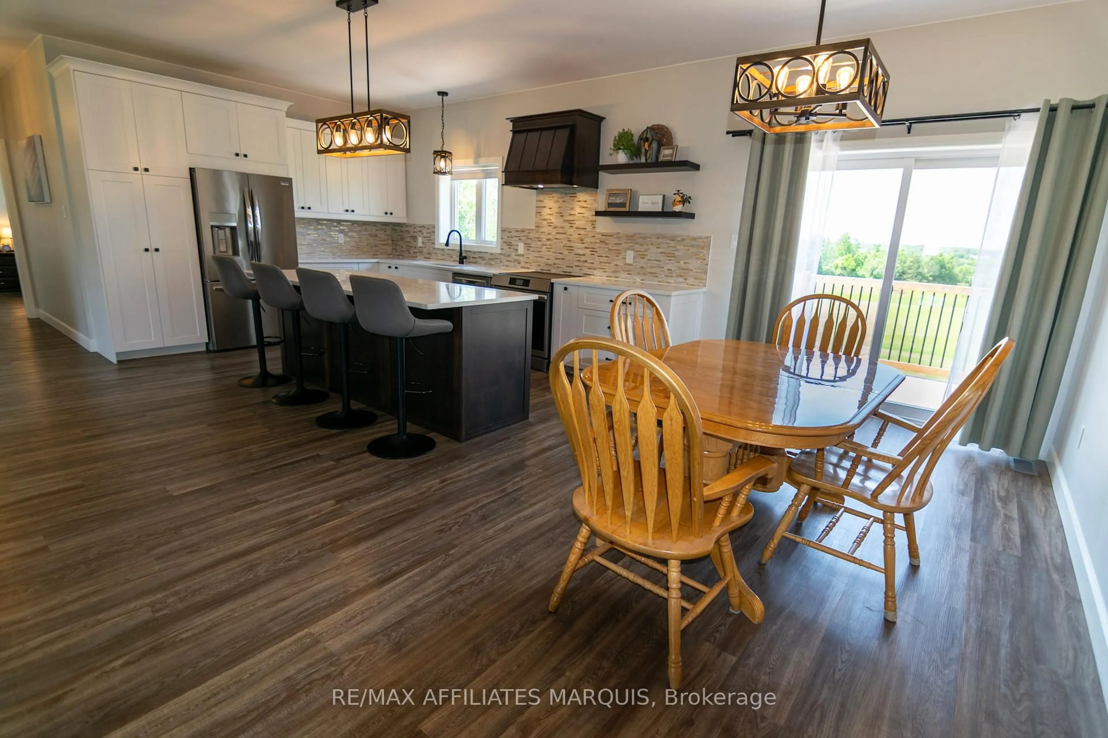 Open concept kitchen, wood/laminate floor for 485 PIONEER Rd, Merrickville-Wolford Ontario K0G 1N0