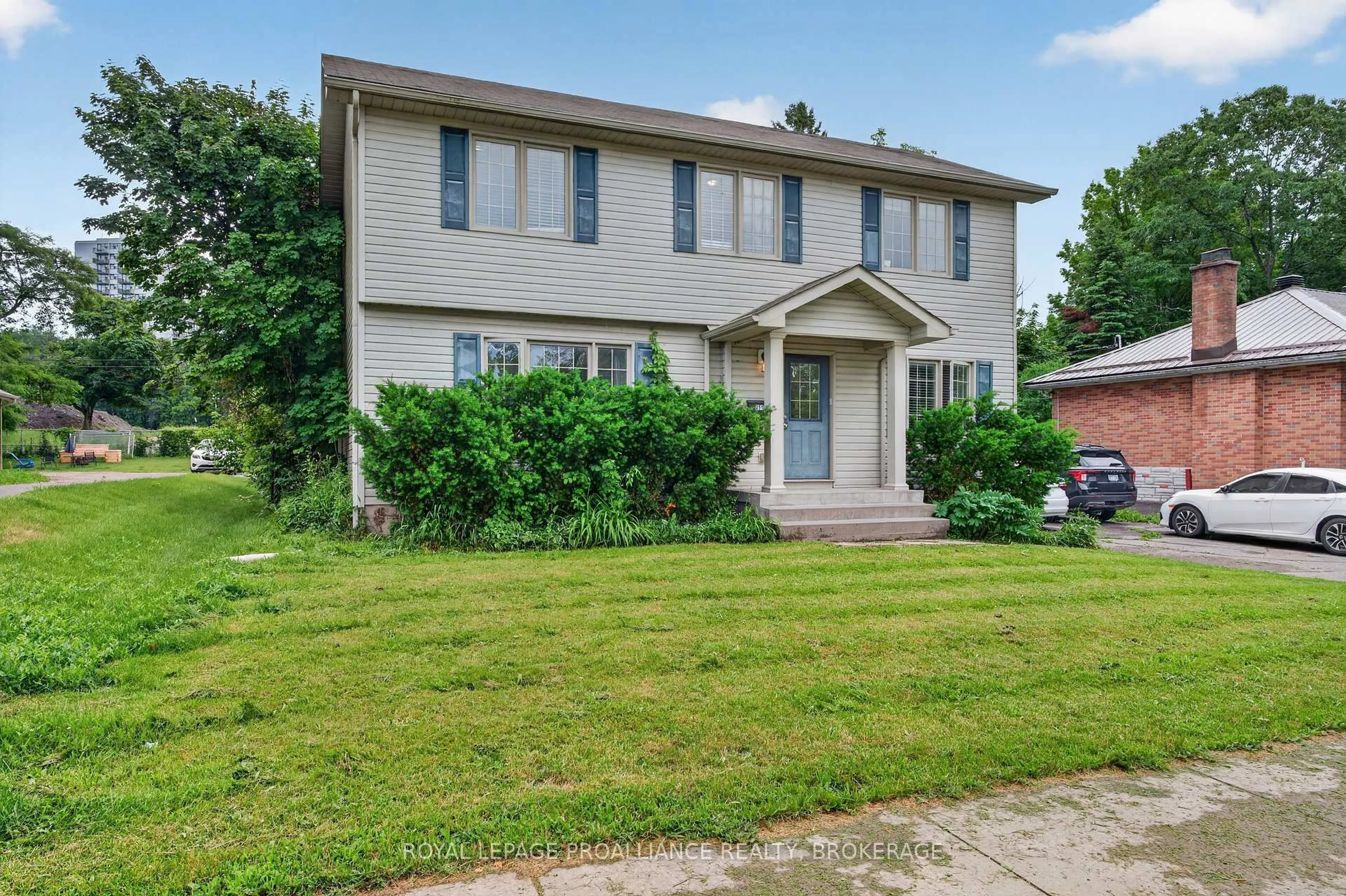 Home with vinyl exterior material, street for 251 Yonge St, Kingston Ontario K7M 1G2