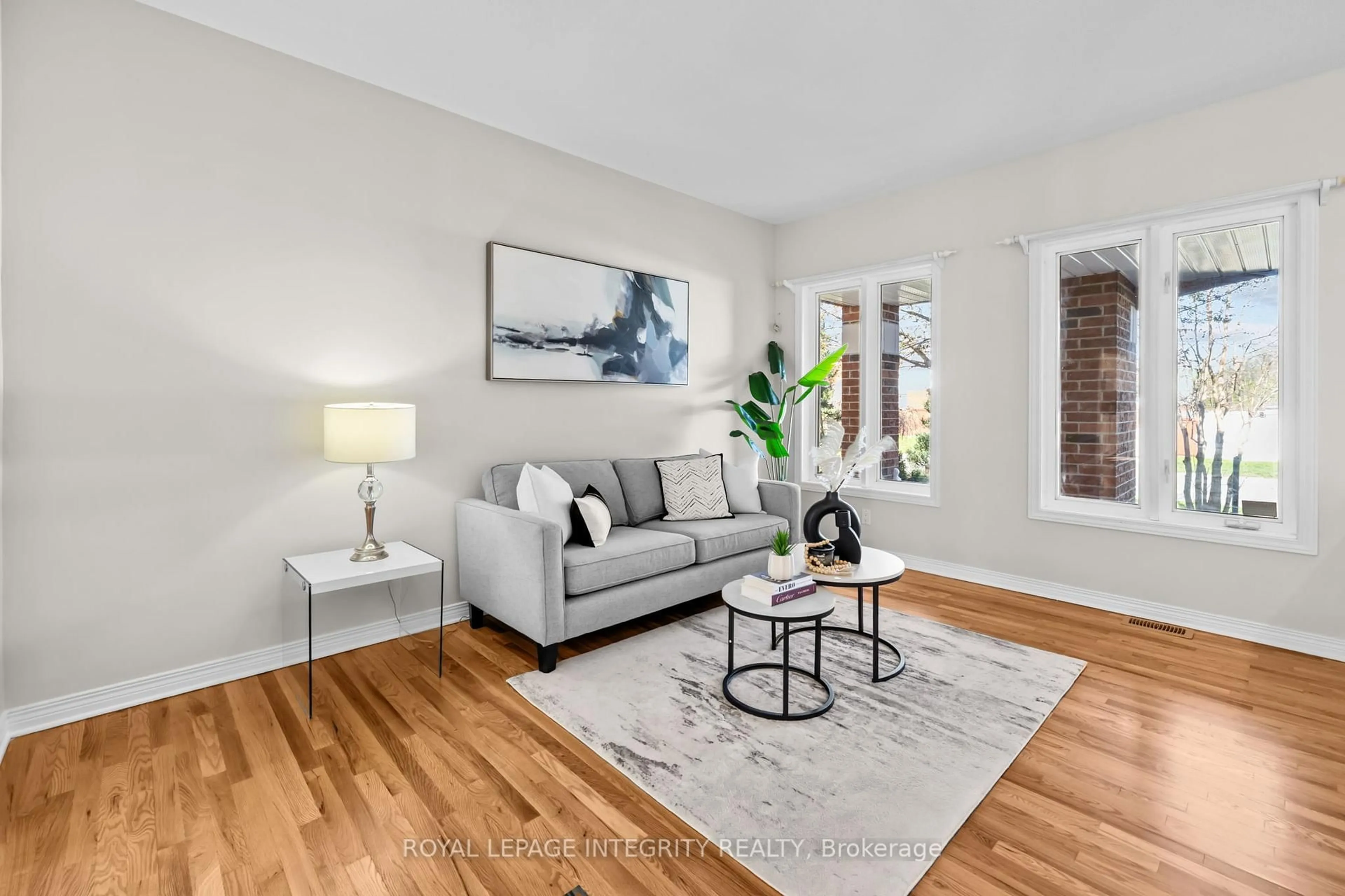 Living room with furniture, wood/laminate floor for 4 Tamarack Pl, Ottawa Ontario K2J 4R3