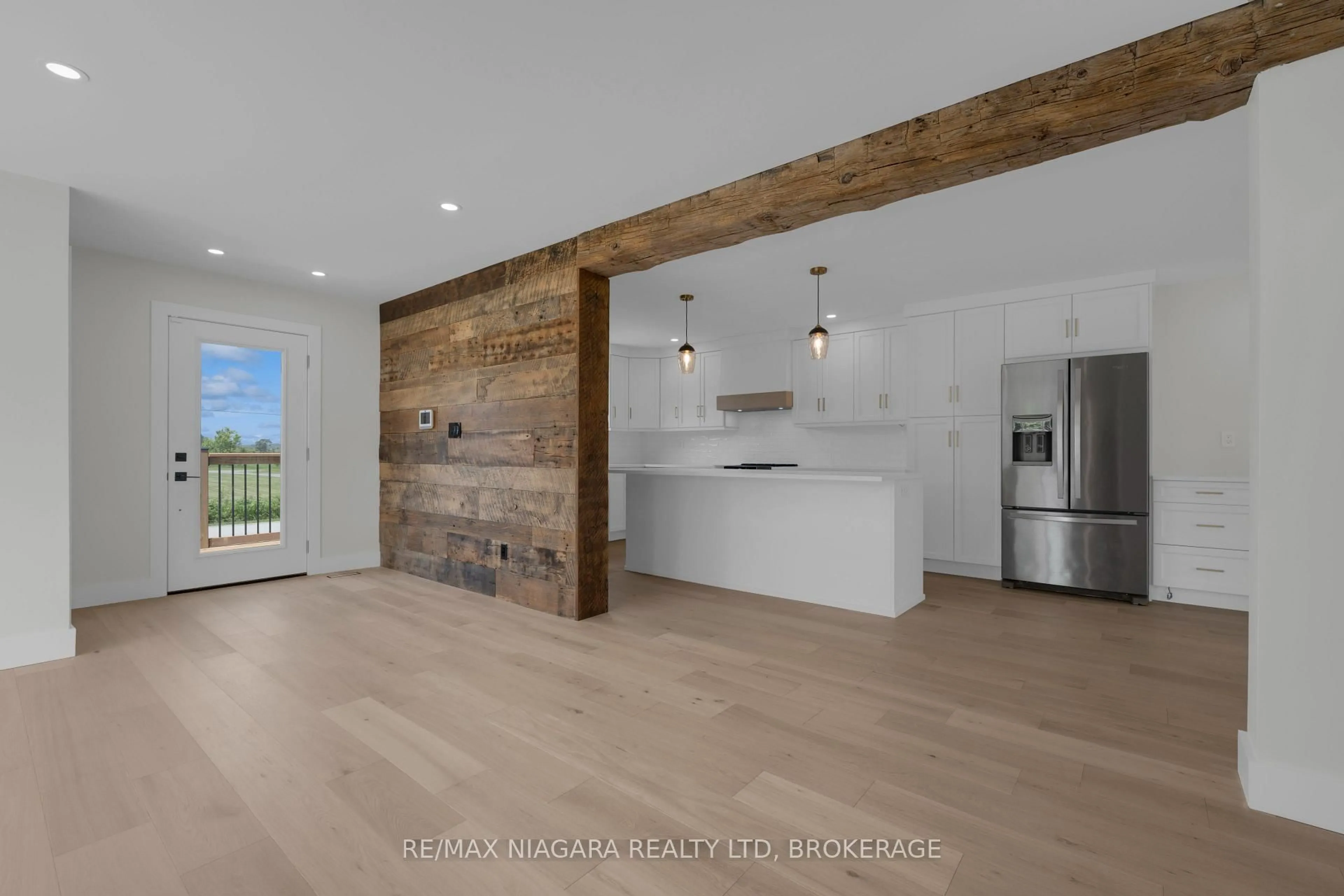 Open concept kitchen, wood/laminate floor for 11809 Sideroad 18, Wainfleet Ontario L0S 1V0