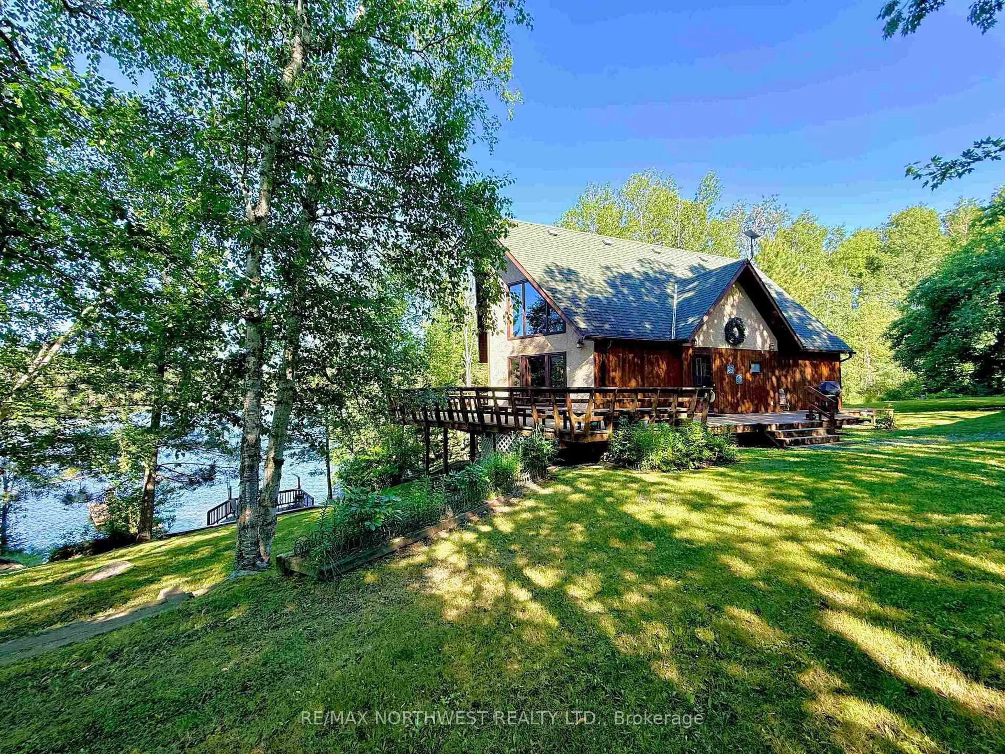 A pic from outside/outdoor area/front of a property/back of a property/a pic from drone, water/lake/river/ocean view for 60 Campbell Road, Kenora Ontario P9N 4N3