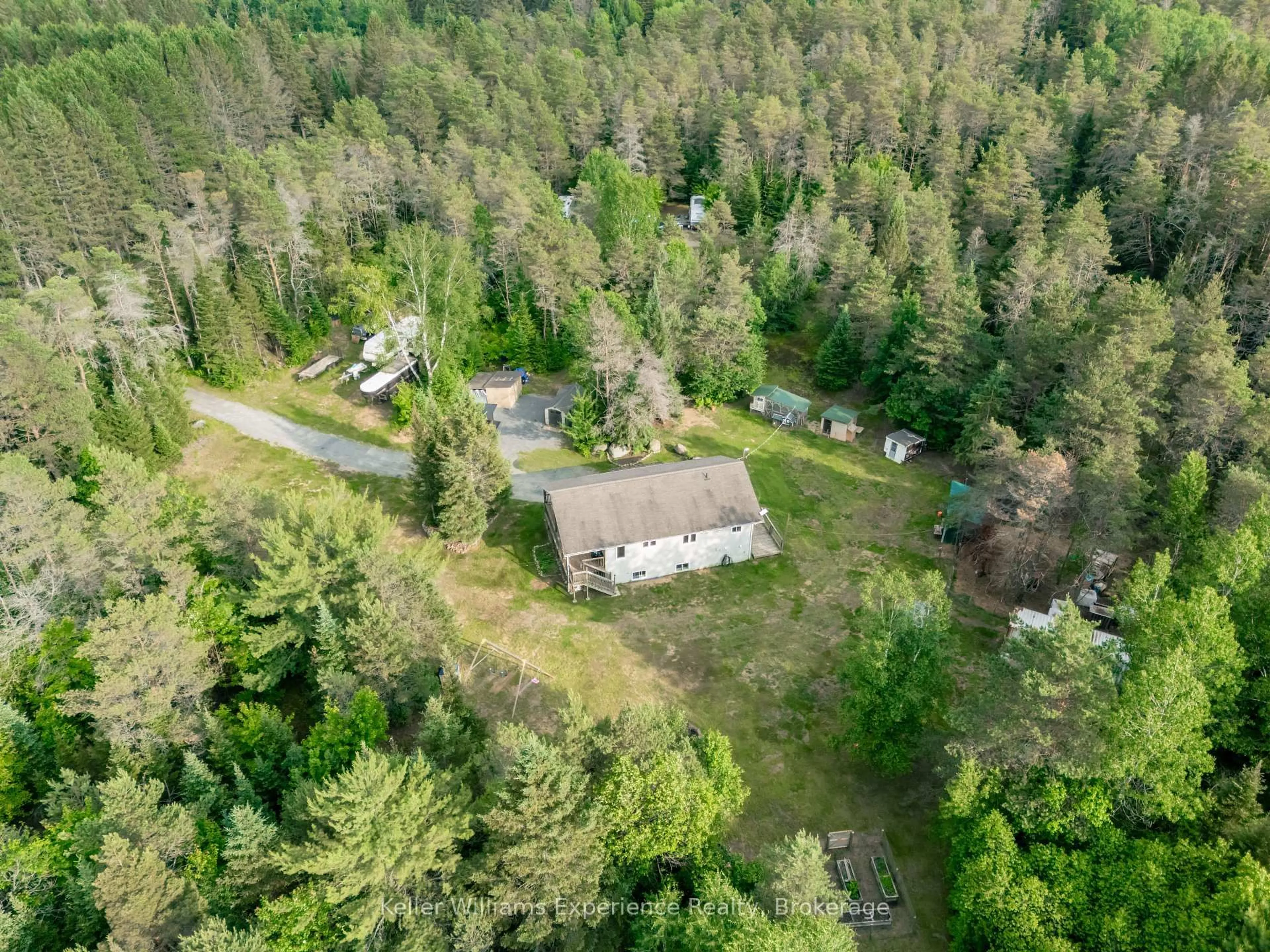 A pic from outside/outdoor area/front of a property/back of a property/a pic from drone, forest/trees view for 235 Rock Point Rd, Kearney Ontario P0A 1M0