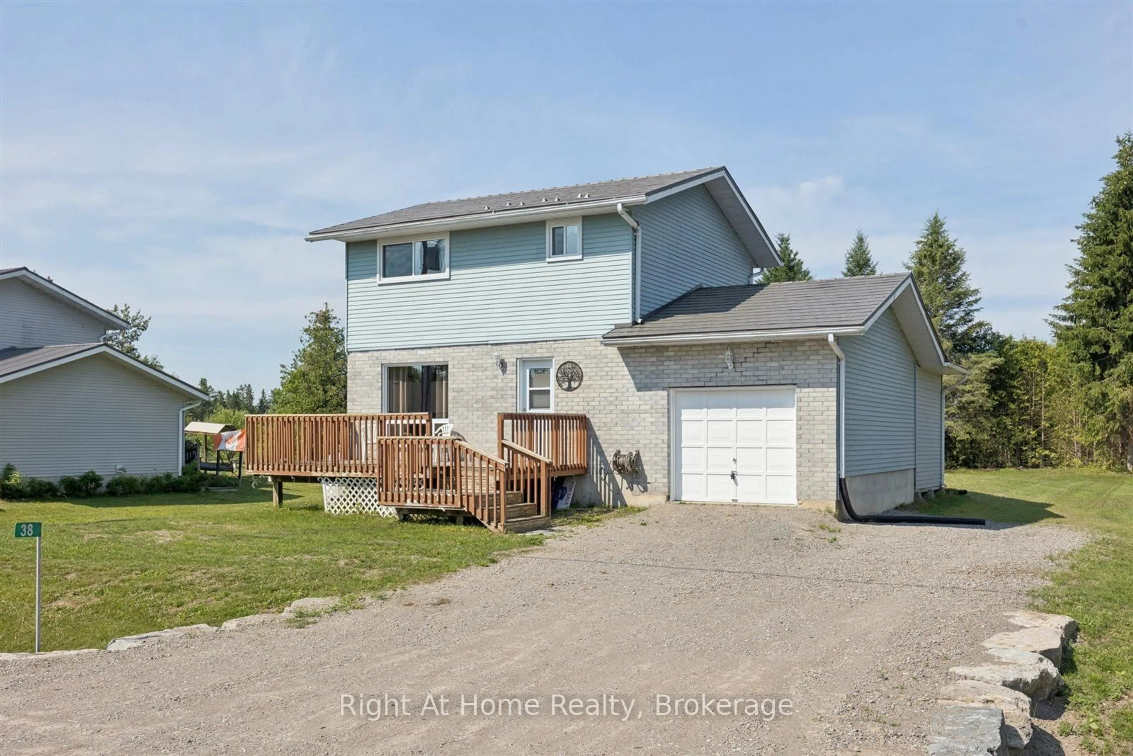 A pic from outside/outdoor area/front of a property/back of a property/a pic from drone, unknown for 38 Trent River Rd, Kawartha Lakes Ontario K0M 2T0