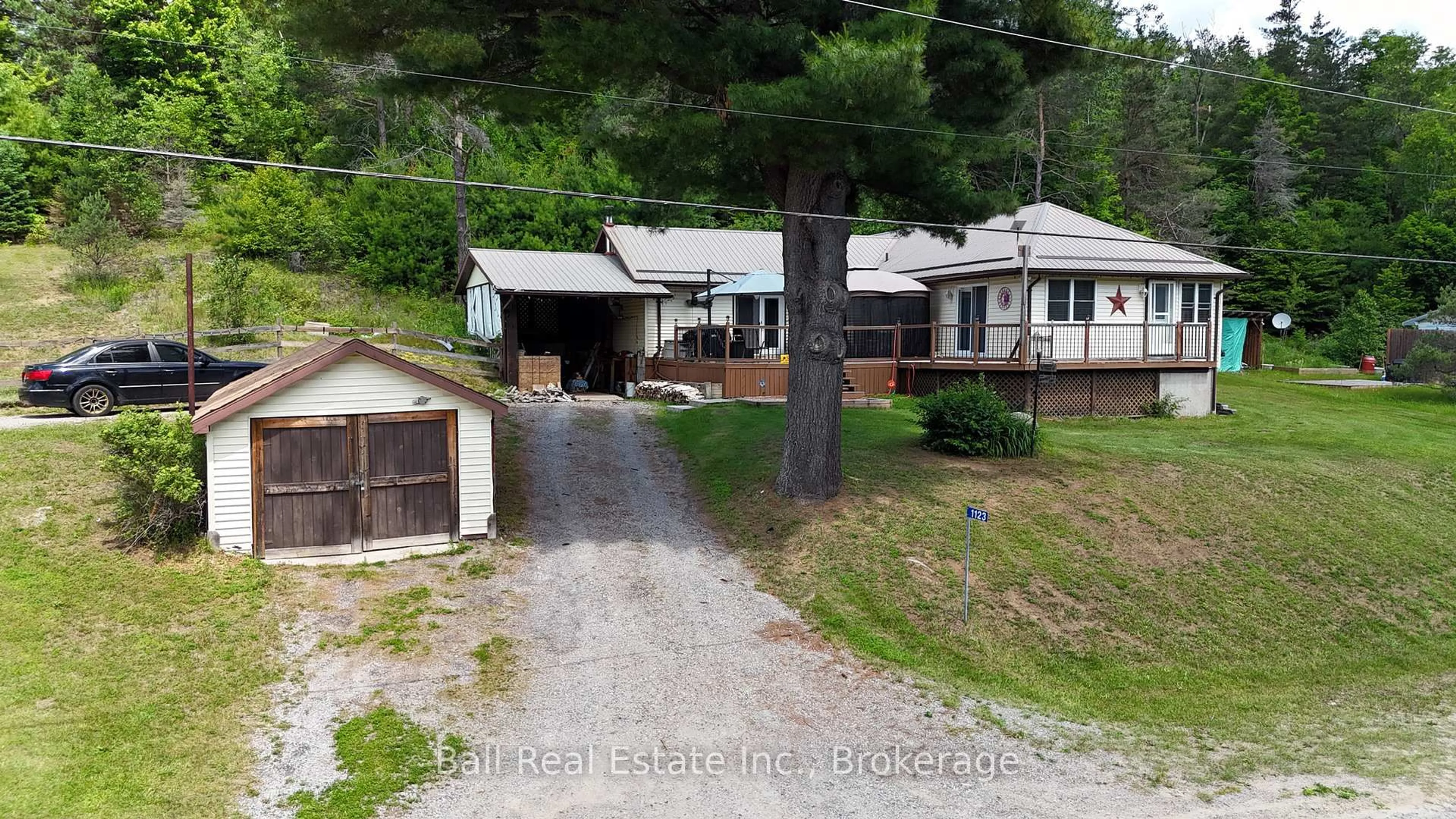 A pic from outside/outdoor area/front of a property/back of a property/a pic from drone, street for 1123 Harcourt Rd, Dysart et al Ontario K0L 1X0