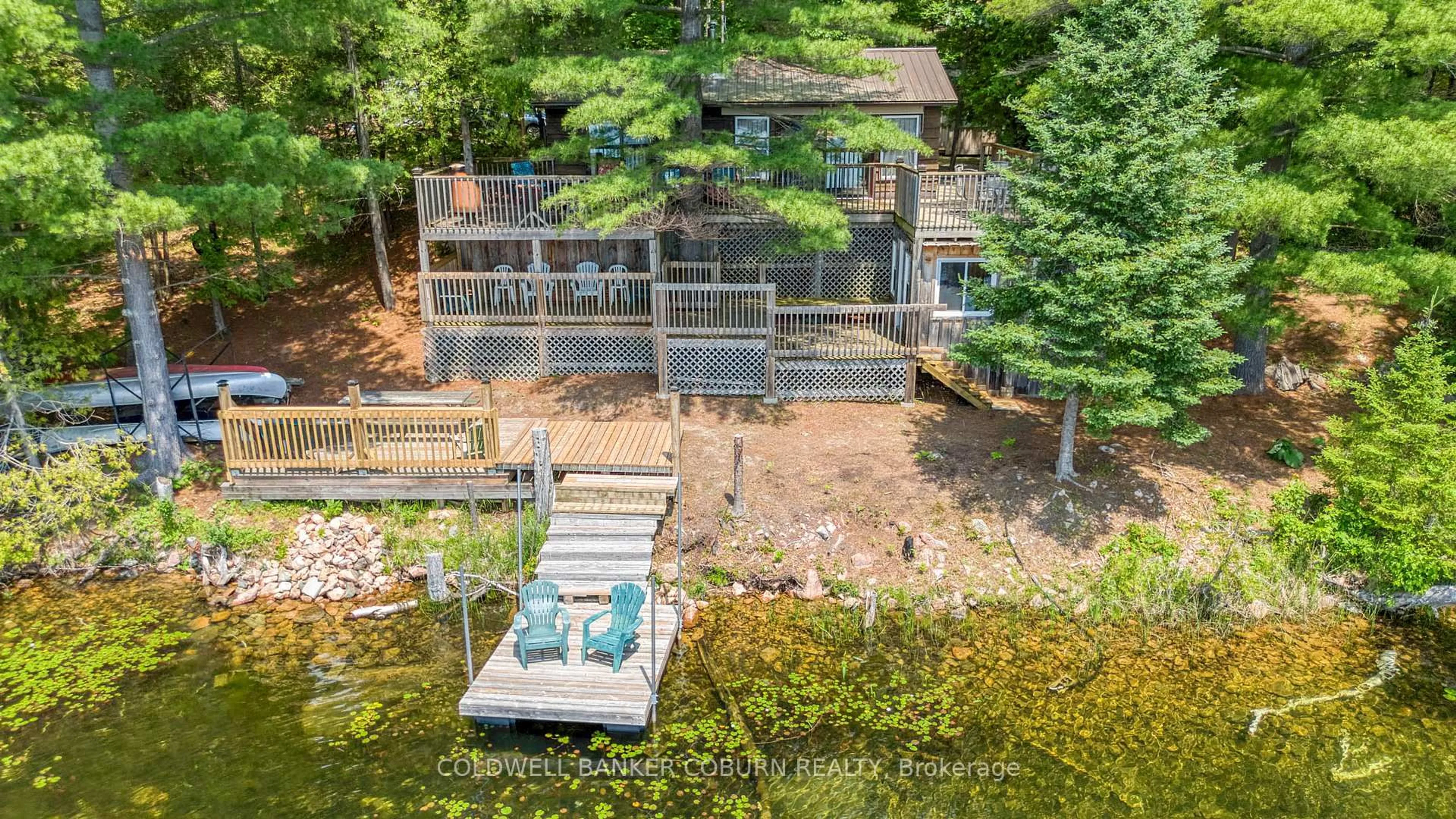 A pic from outside/outdoor area/front of a property/back of a property/a pic from drone, water/lake/river/ocean view for 1015 Oak Lane, Sharbot Lake Ontario K0H 2P0