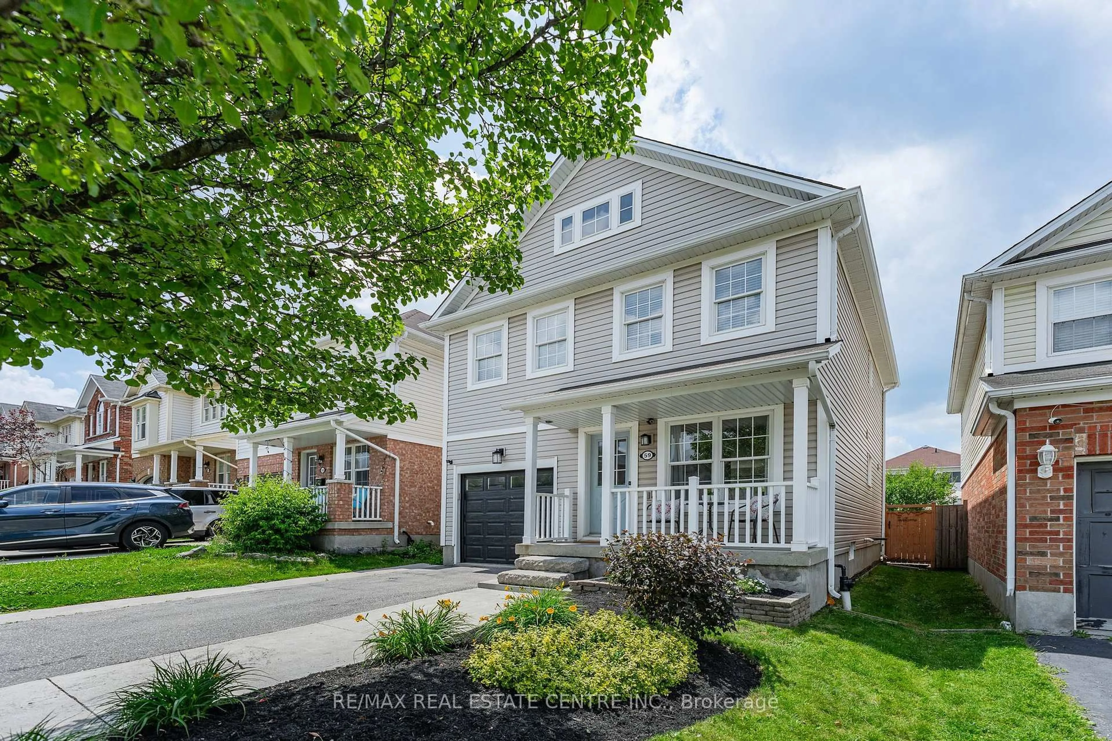 Home with vinyl exterior material, street for 59 Yeaman Dr, Cambridge Ontario N1P 1J6