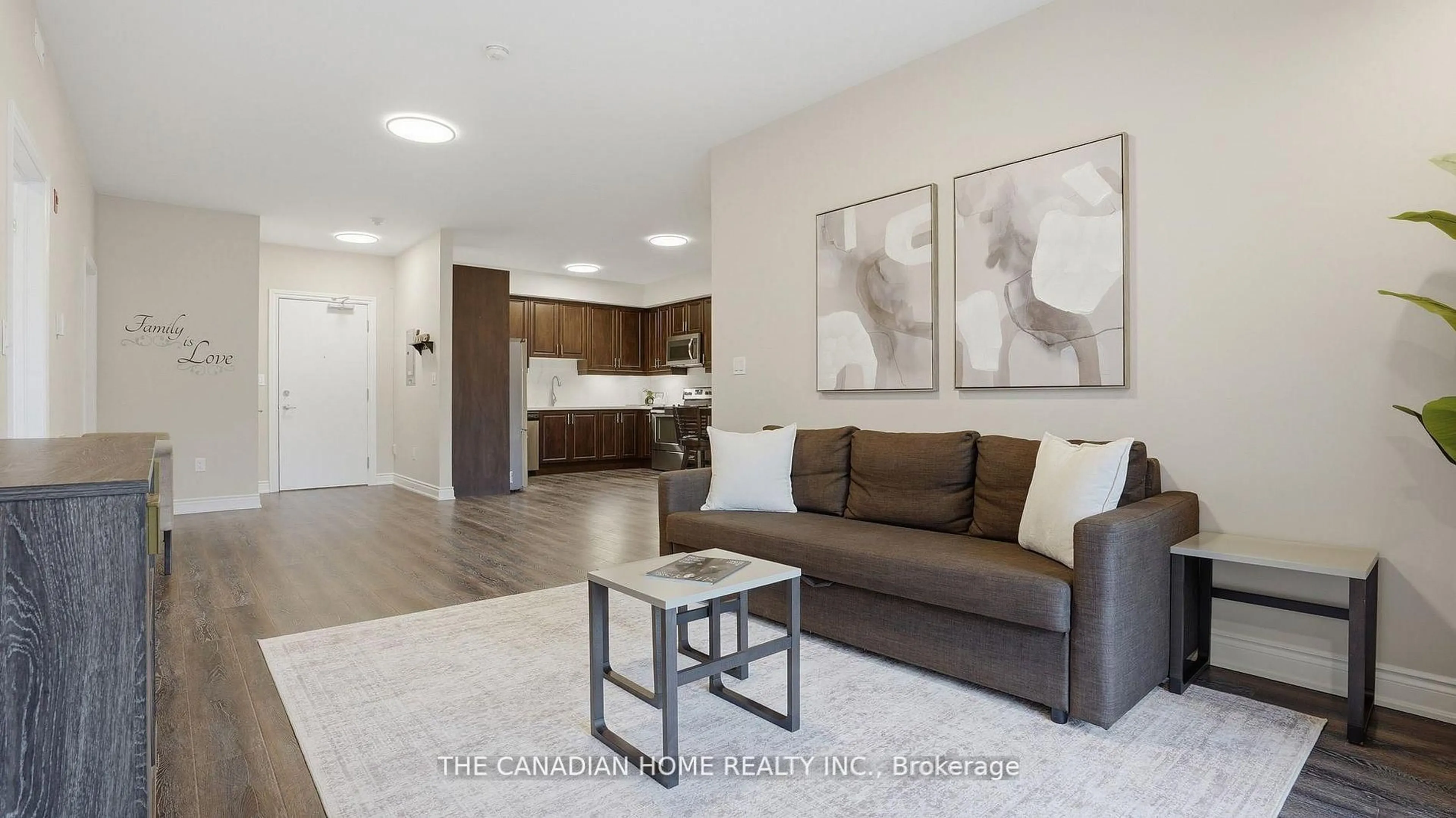 Living room with furniture, wood/laminate floor for 8111 Forest Glen Dr #332, Niagara Falls Ontario L2H 2Y7