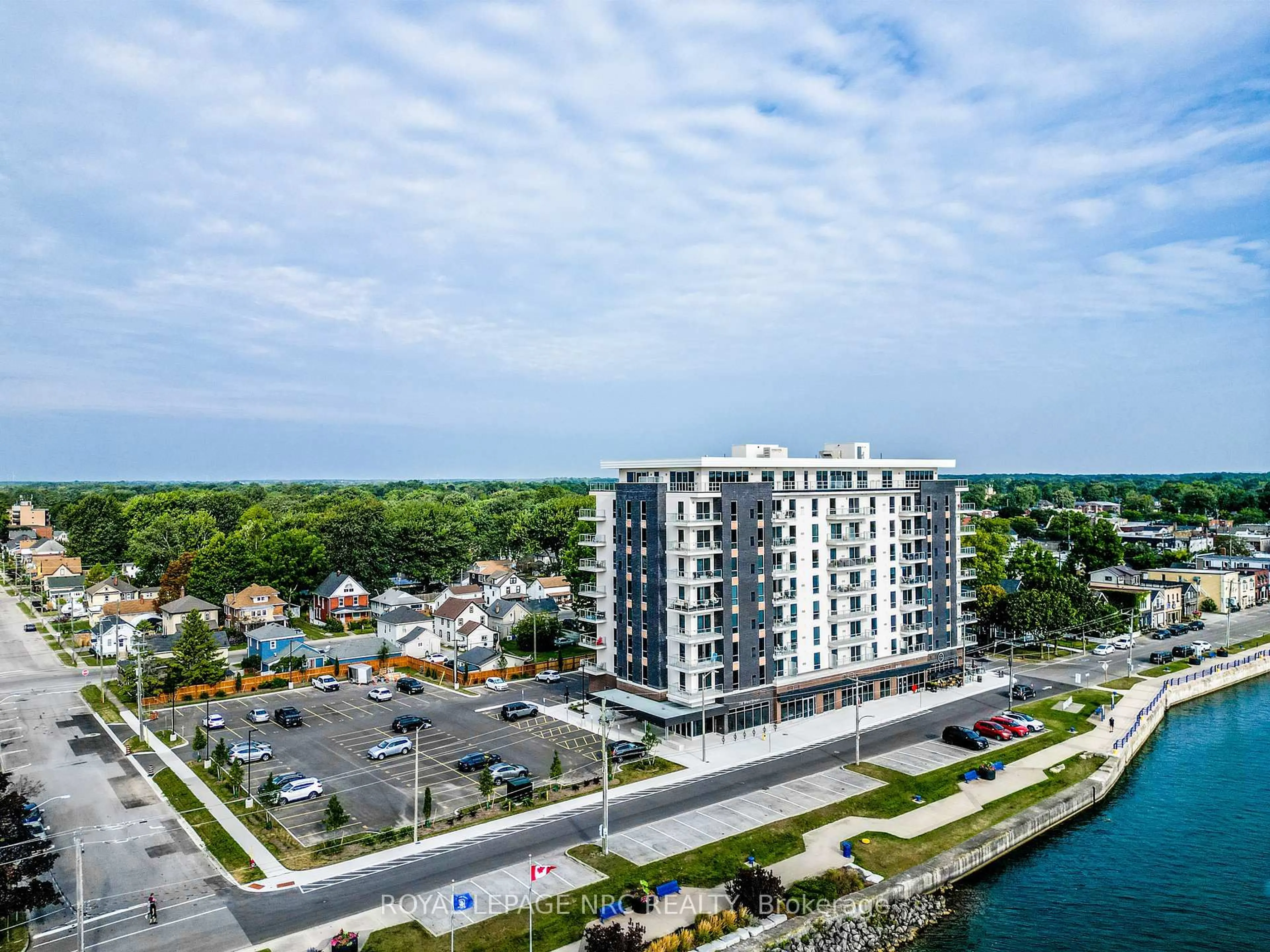 A pic from outside/outdoor area/front of a property/back of a property/a pic from drone, water/lake/river/ocean view for 118 West St #204, Port Colborne Ontario L3K 0B9