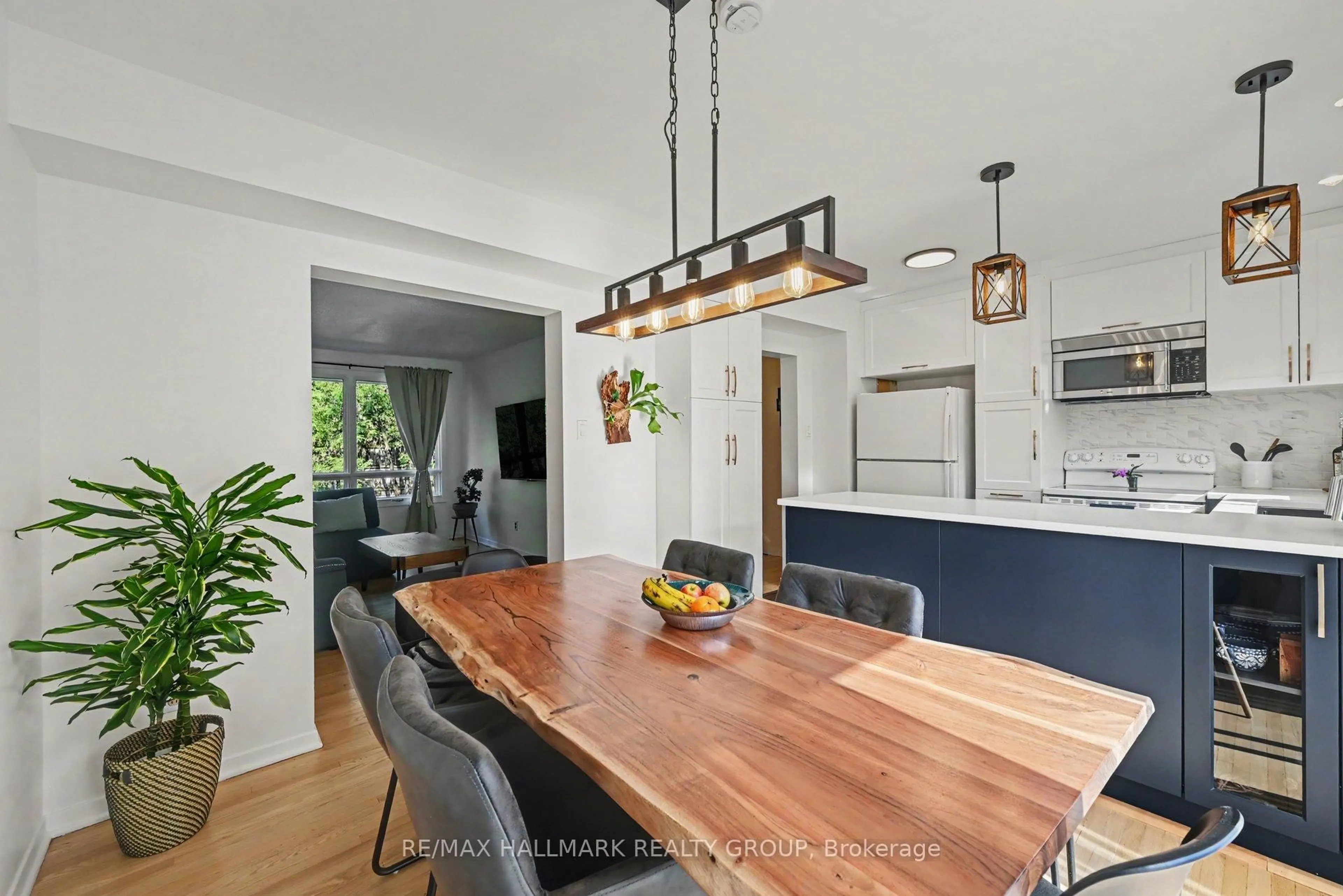 Open concept kitchen, wood/laminate floor for 763B Ridgewood Ave, Ottawa Ontario K1V 6M8