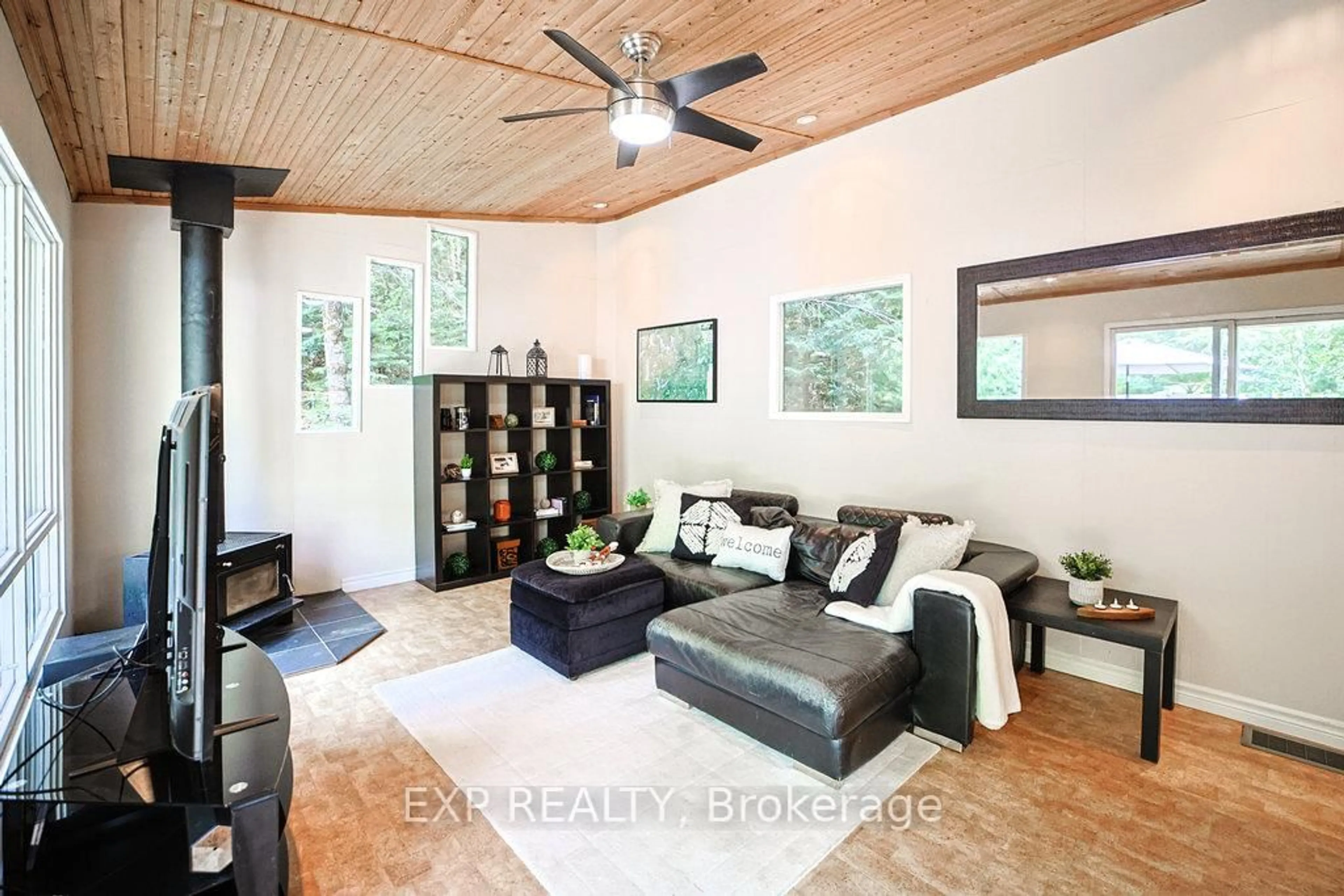 Living room with furniture, wood/laminate floor for 565 West Diamond Lake Rd, Haliburton Ontario K0L 2A0