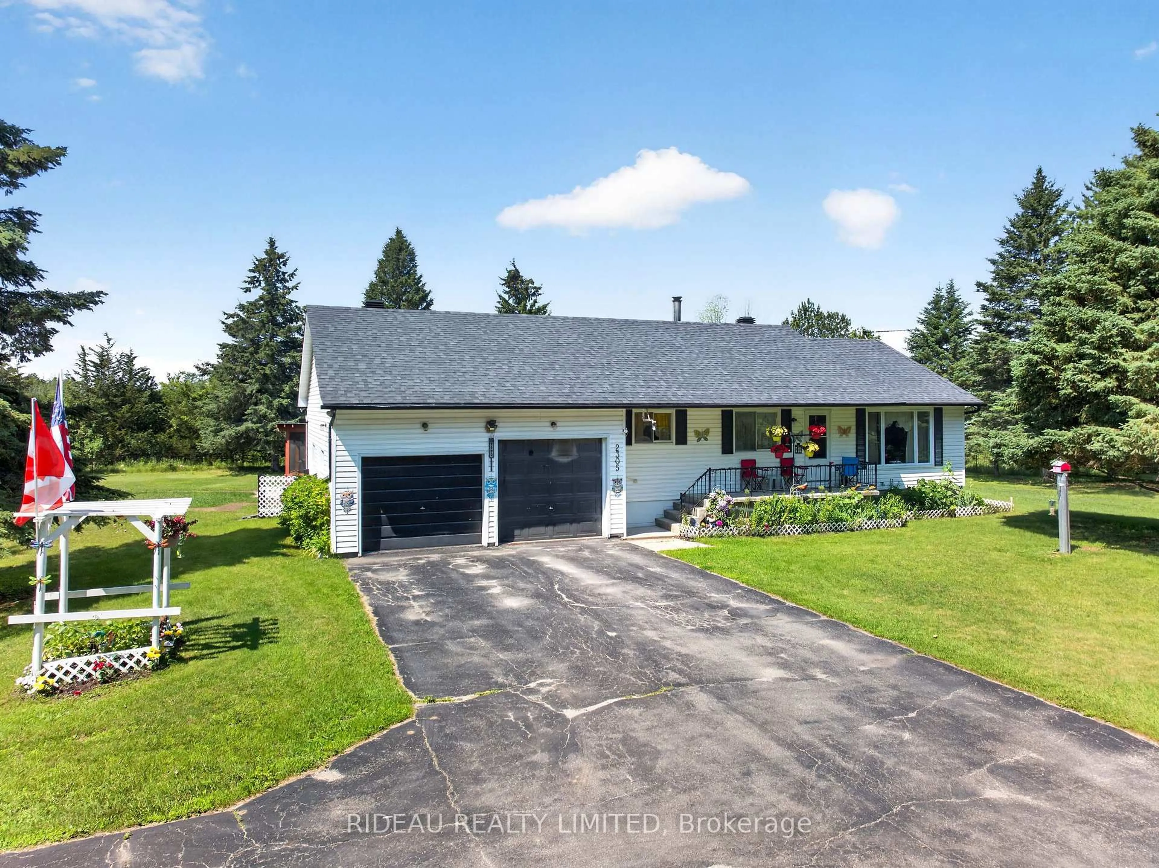 A pic from outside/outdoor area/front of a property/back of a property/a pic from drone, street for 2305 Harlem Rd, Rideau Lakes Ontario K0G 1V0