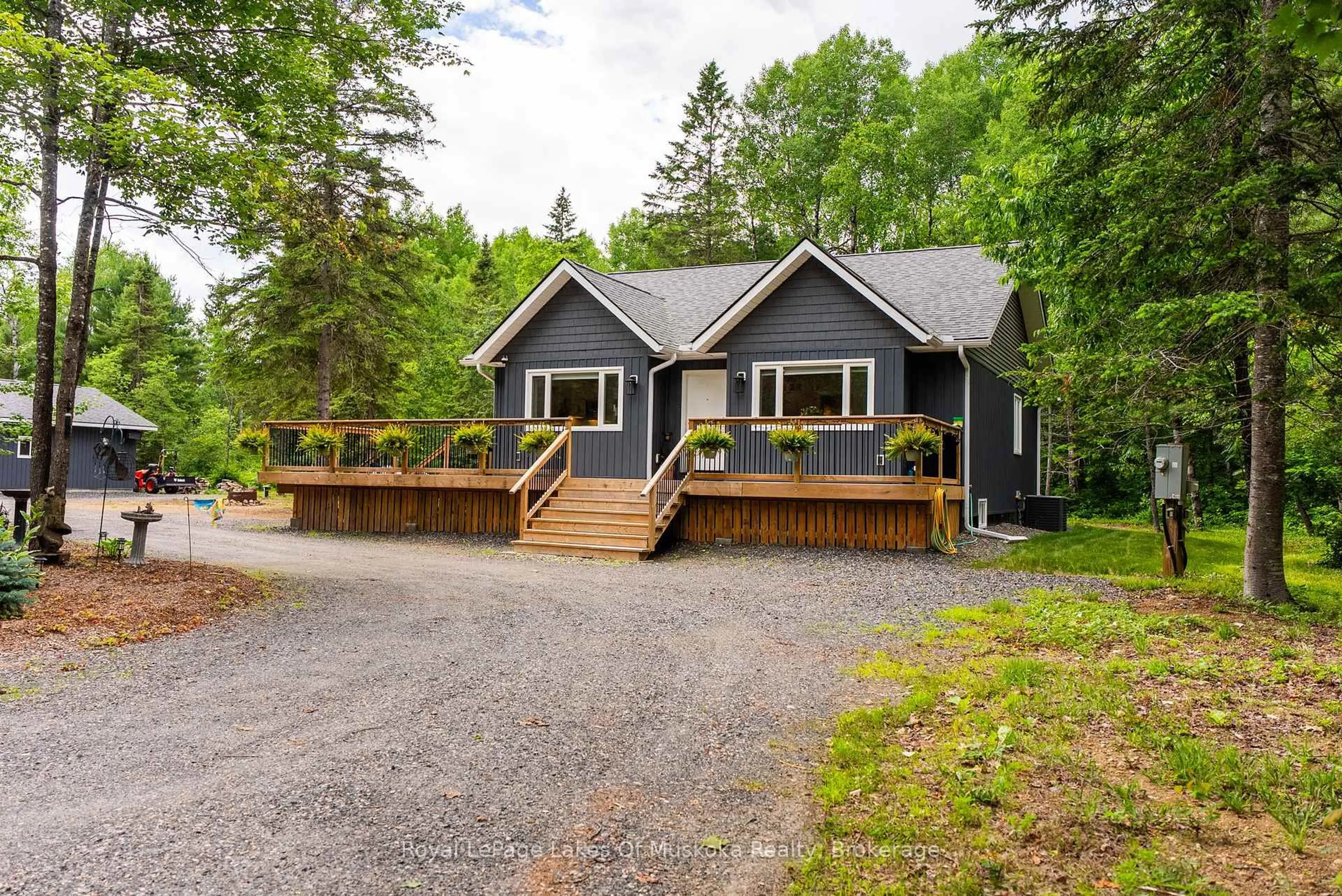 Home with vinyl exterior material, street for 1053 Spring Lake Rd, Lake of Bays Ontario P0A 1H0