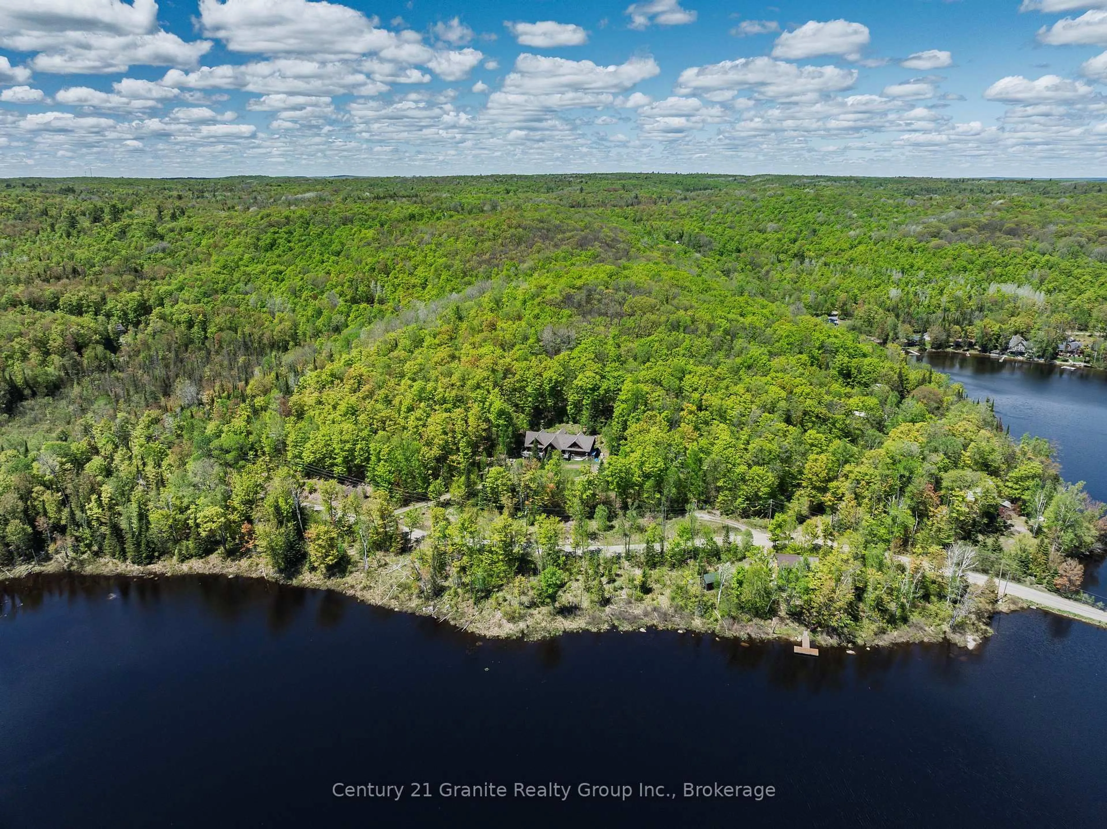 A pic from outside/outdoor area/front of a property/back of a property/a pic from drone, water/lake/river/ocean view for 1123 Dardanelles Rd, Dysart et al Ontario K0M 1S0