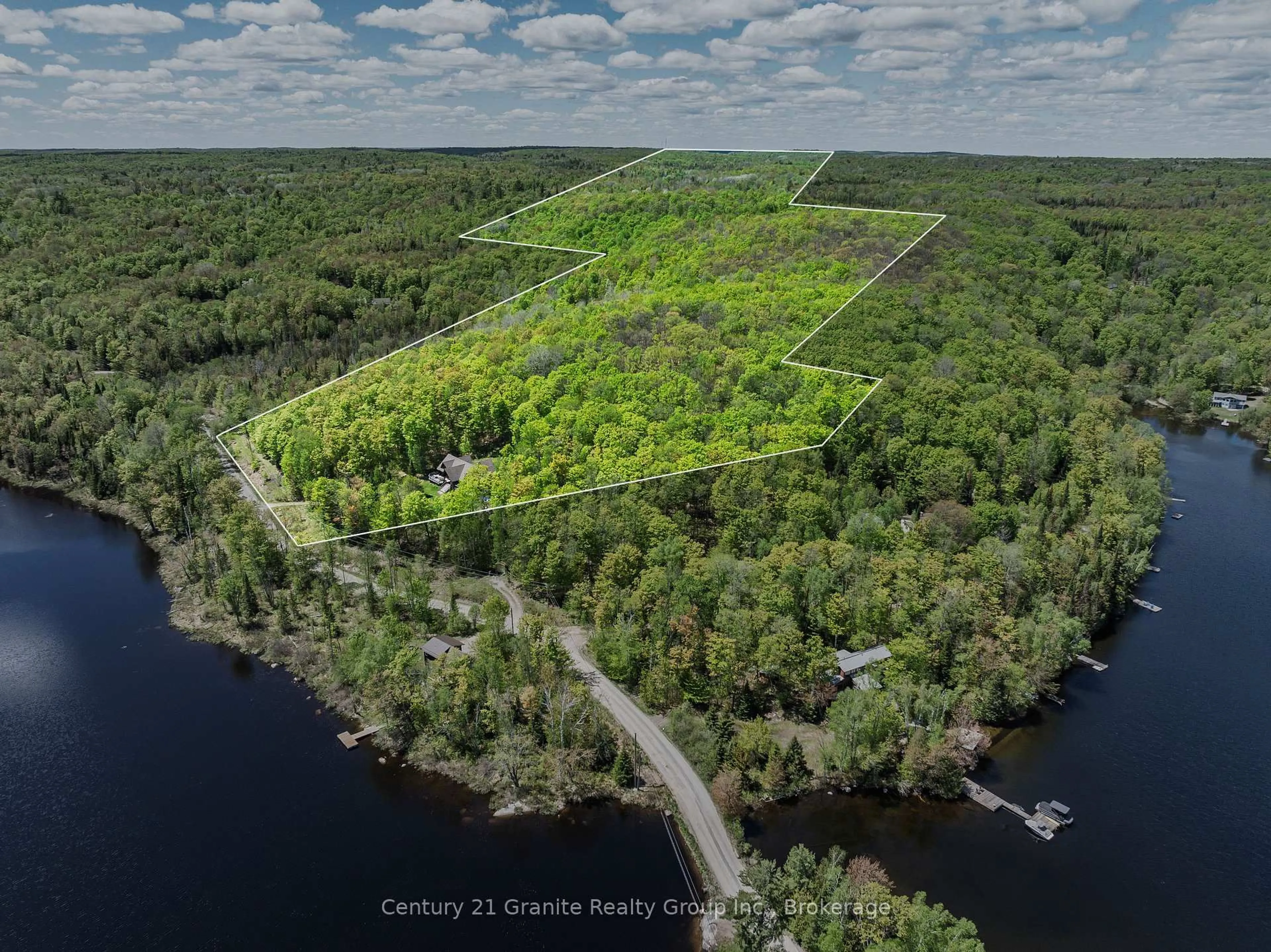 A pic from outside/outdoor area/front of a property/back of a property/a pic from drone, water/lake/river/ocean view for 1123 Dardanelles Rd, Dysart et al Ontario K0M 1S0