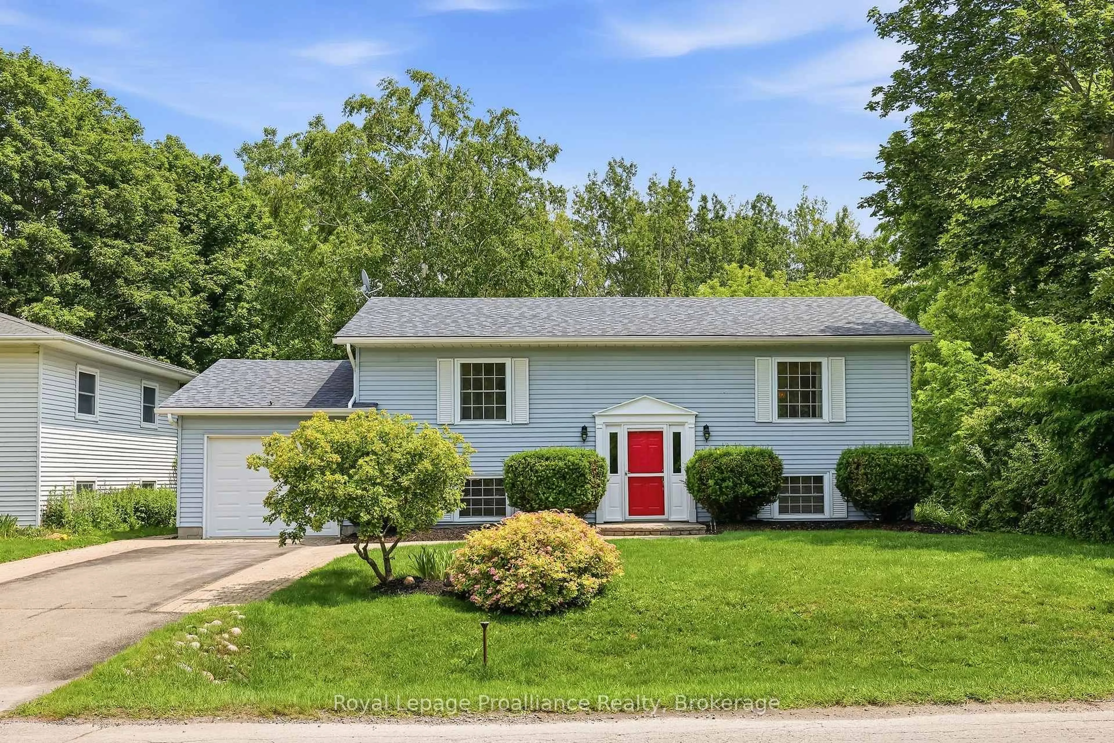 Home with vinyl exterior material, street for 23 Harbour St, Brighton Ontario K0K 1H0