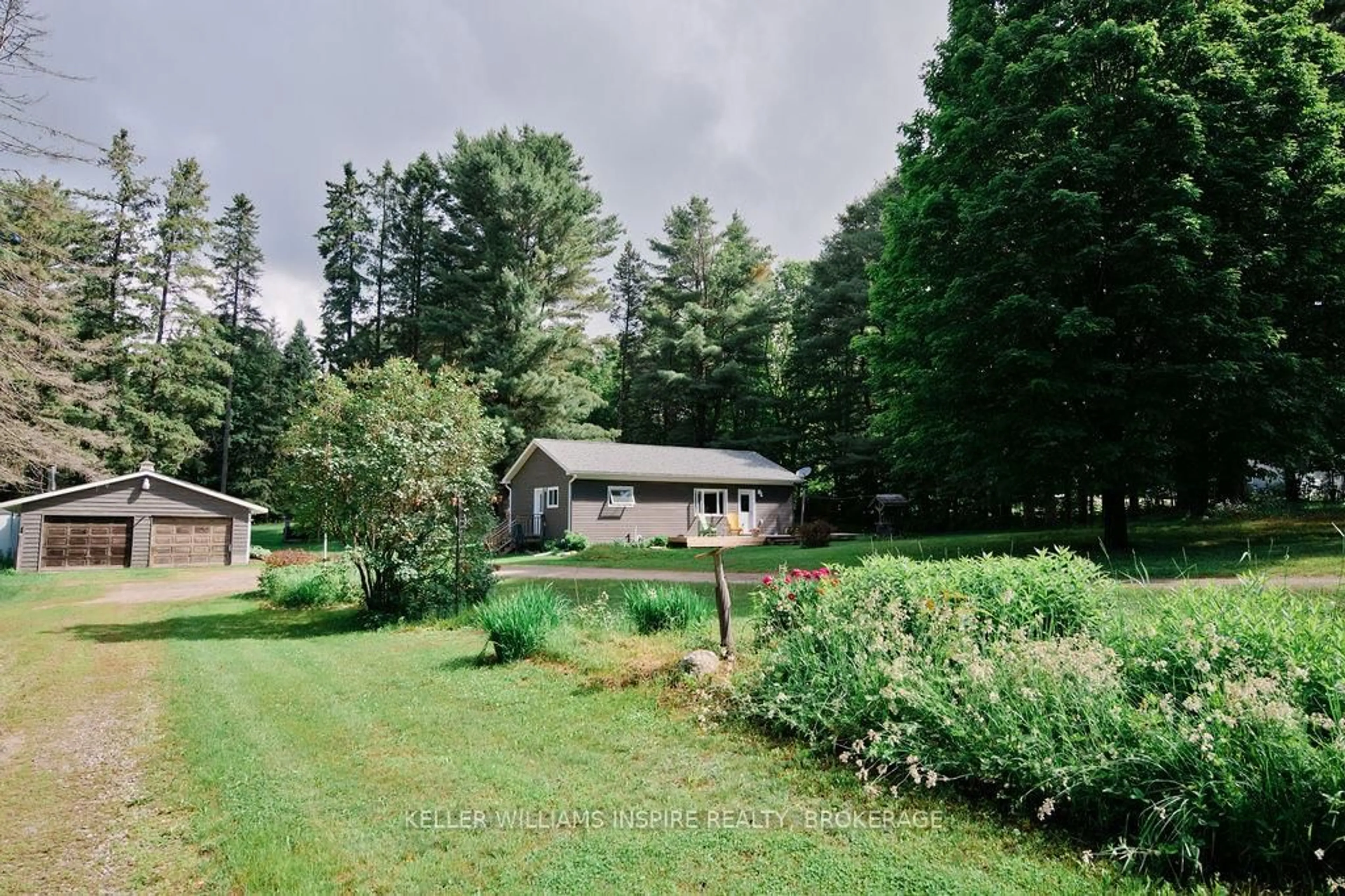 A pic from outside/outdoor area/front of a property/back of a property/a pic from drone, forest/trees view for 2352 Highway 518 W, McMurrich/Monteith Ontario P0A 1Y0