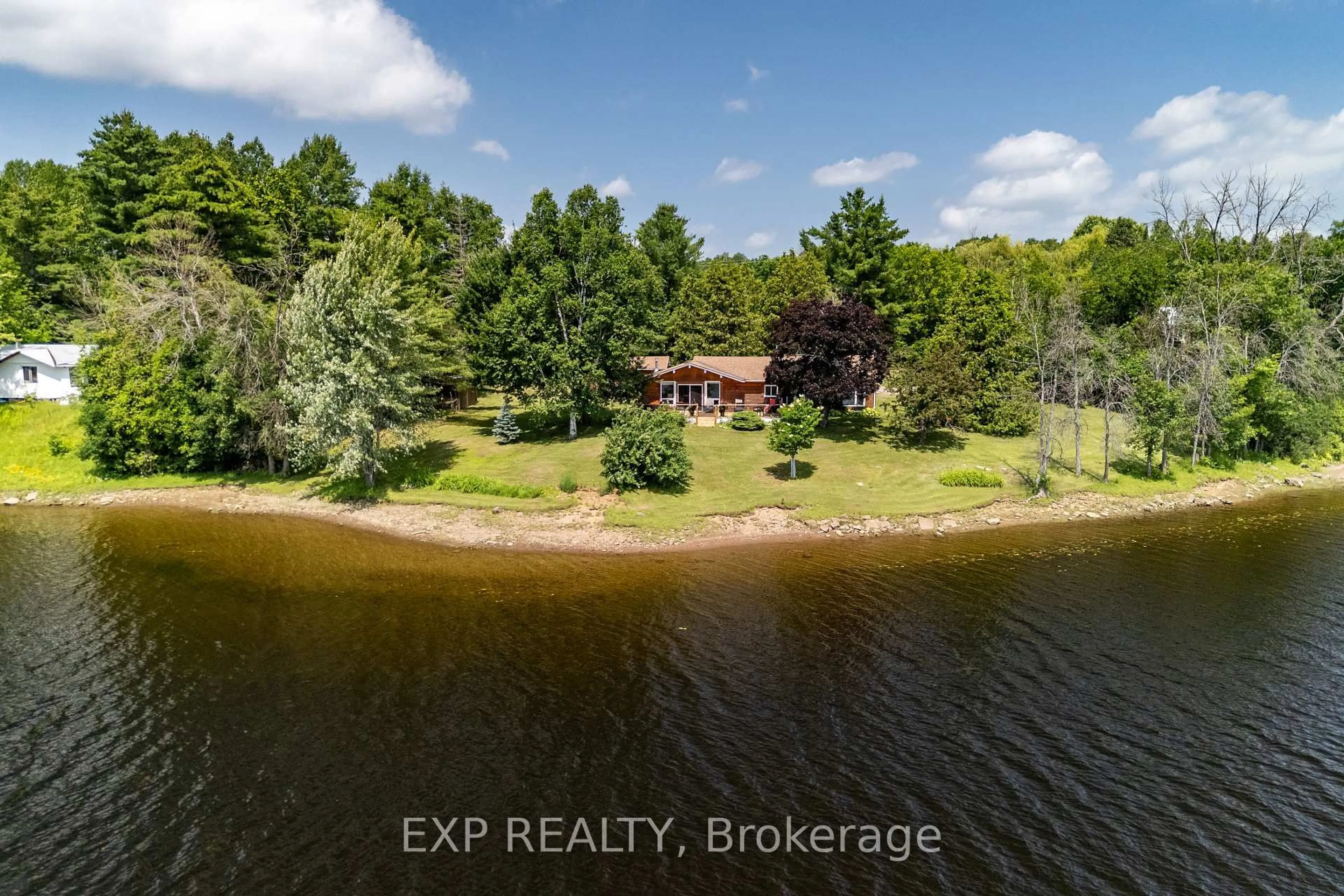 A pic from outside/outdoor area/front of a property/back of a property/a pic from drone, water/lake/river/ocean view for 35 Downing Lane, Calabogie Ontario K0J 1H0