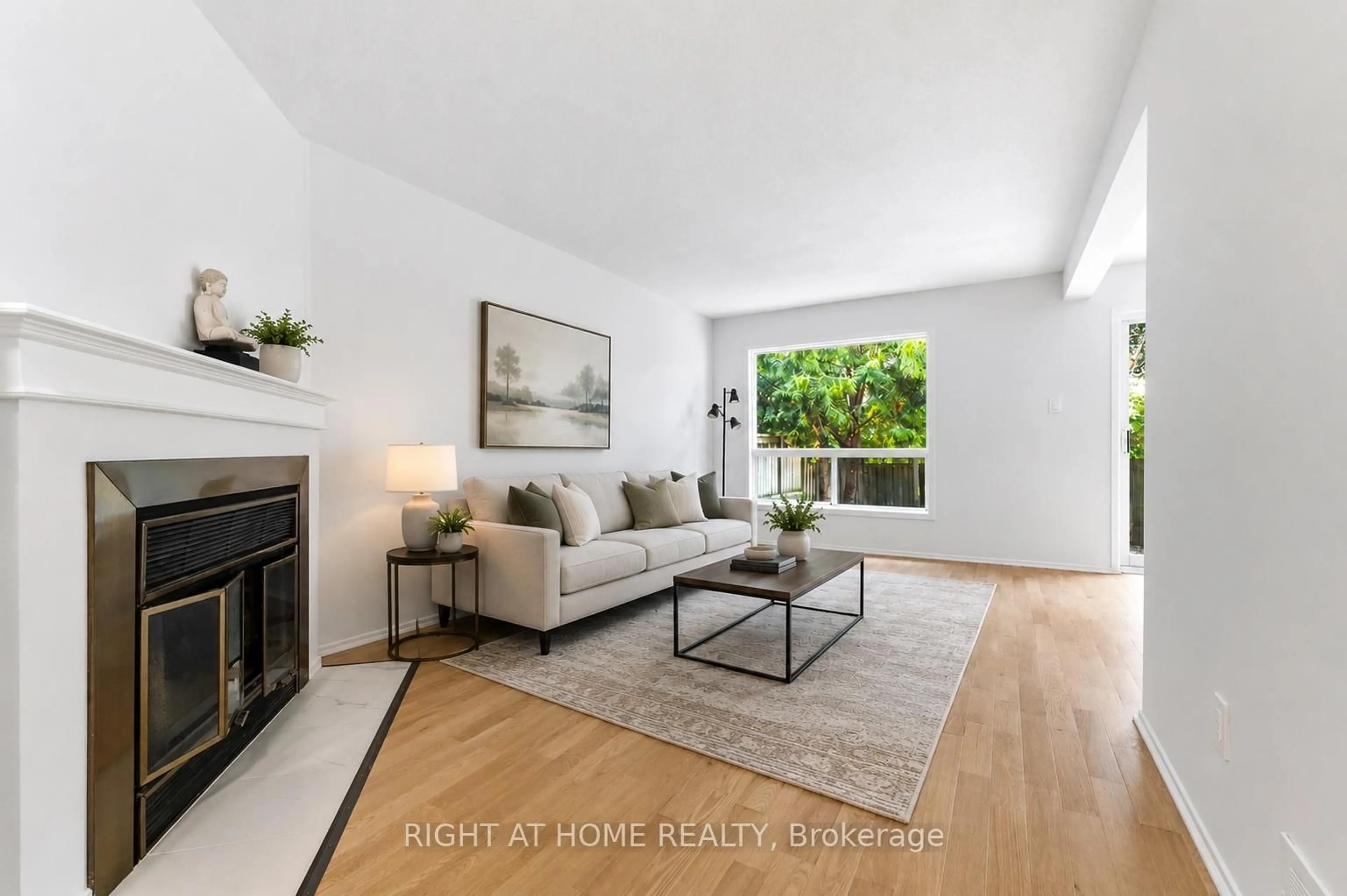 Living room with furniture, wood/laminate floor for 178 Presland Rd, Ottawa Ontario K1K 4J7