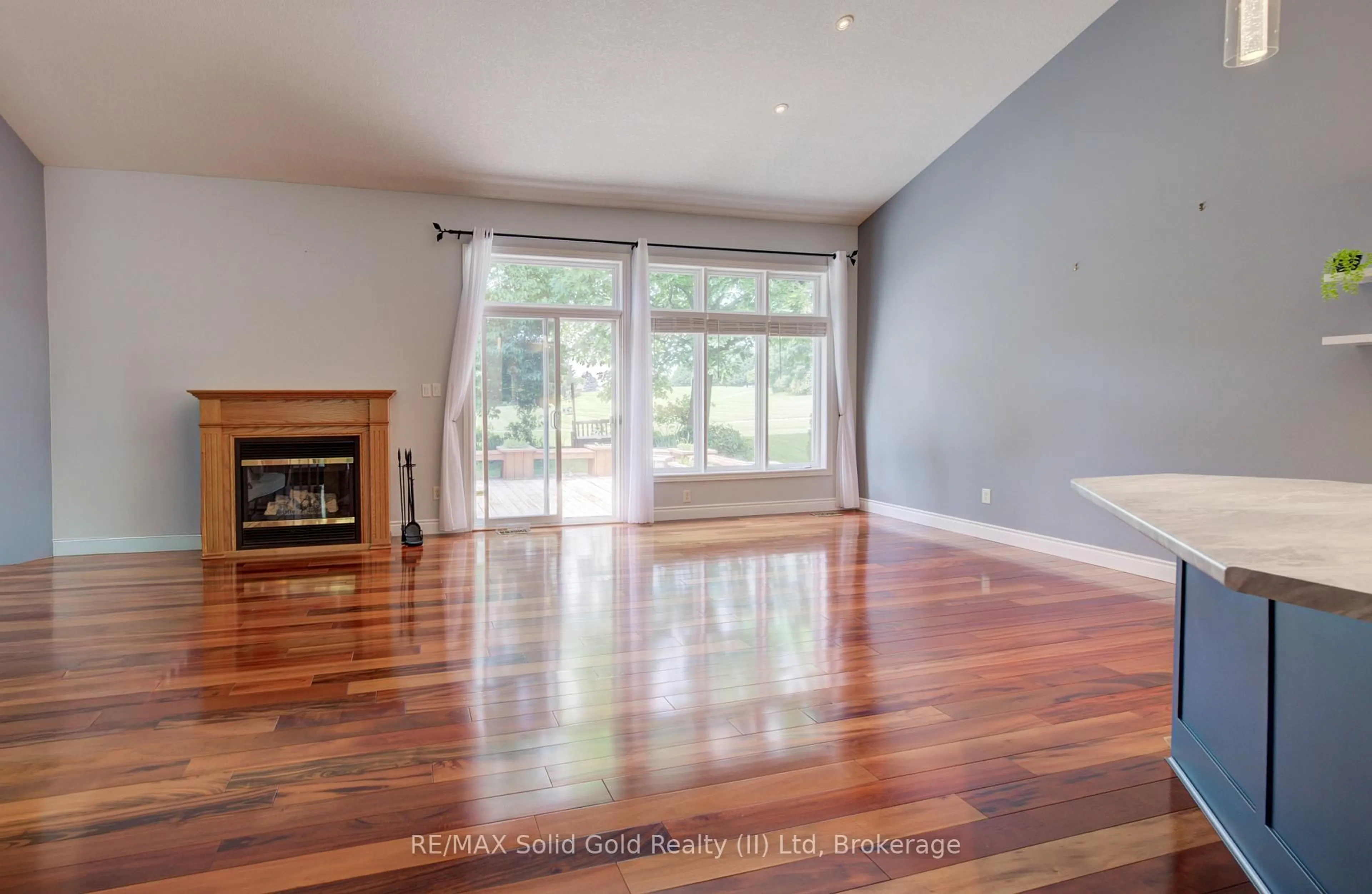 Living room with furniture, wood/laminate floor for 11 Sun Valley Dr, Wilmot Ontario N3A 3P8