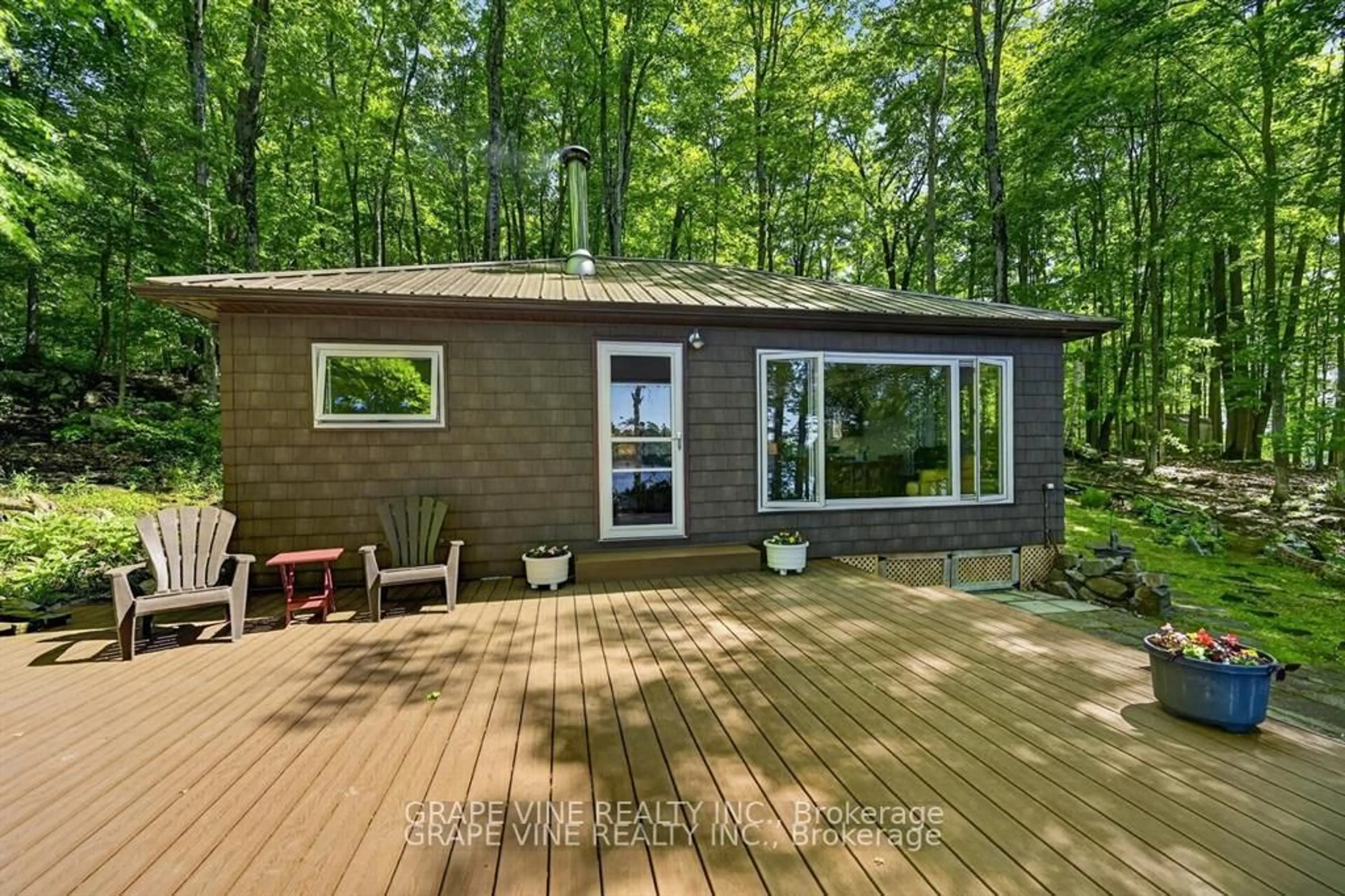 Home with vinyl exterior material, forest/trees view for 1010 Firefly Lane, Perth Road Ontario K0H 2L0