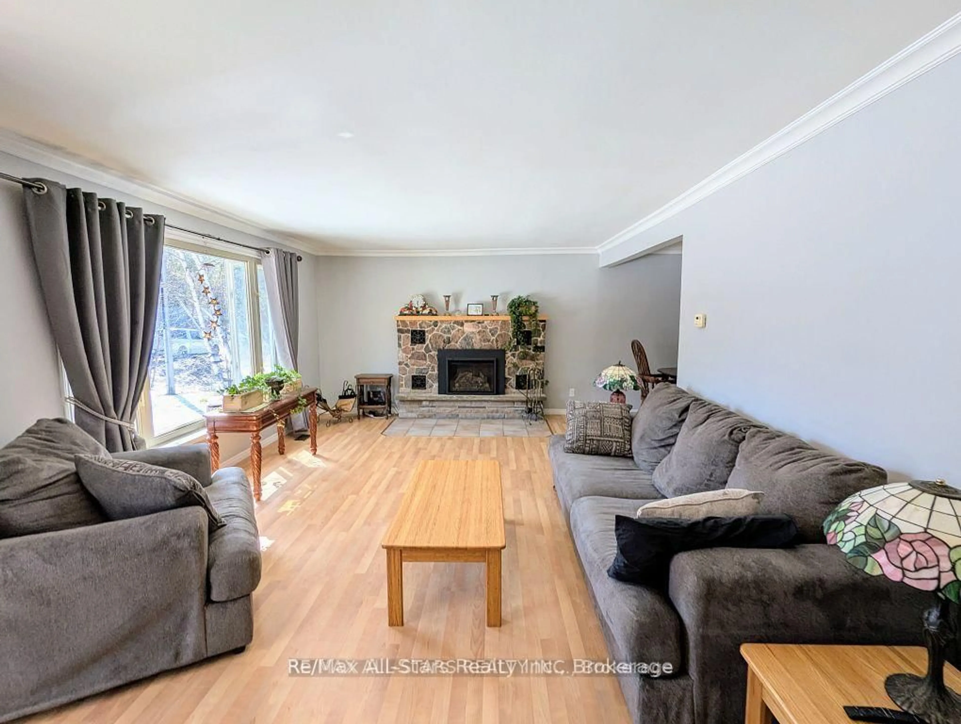 Living room with furniture, wood/laminate floor for 161 McFadden Rd, North Kawartha Ontario K0L 1A0