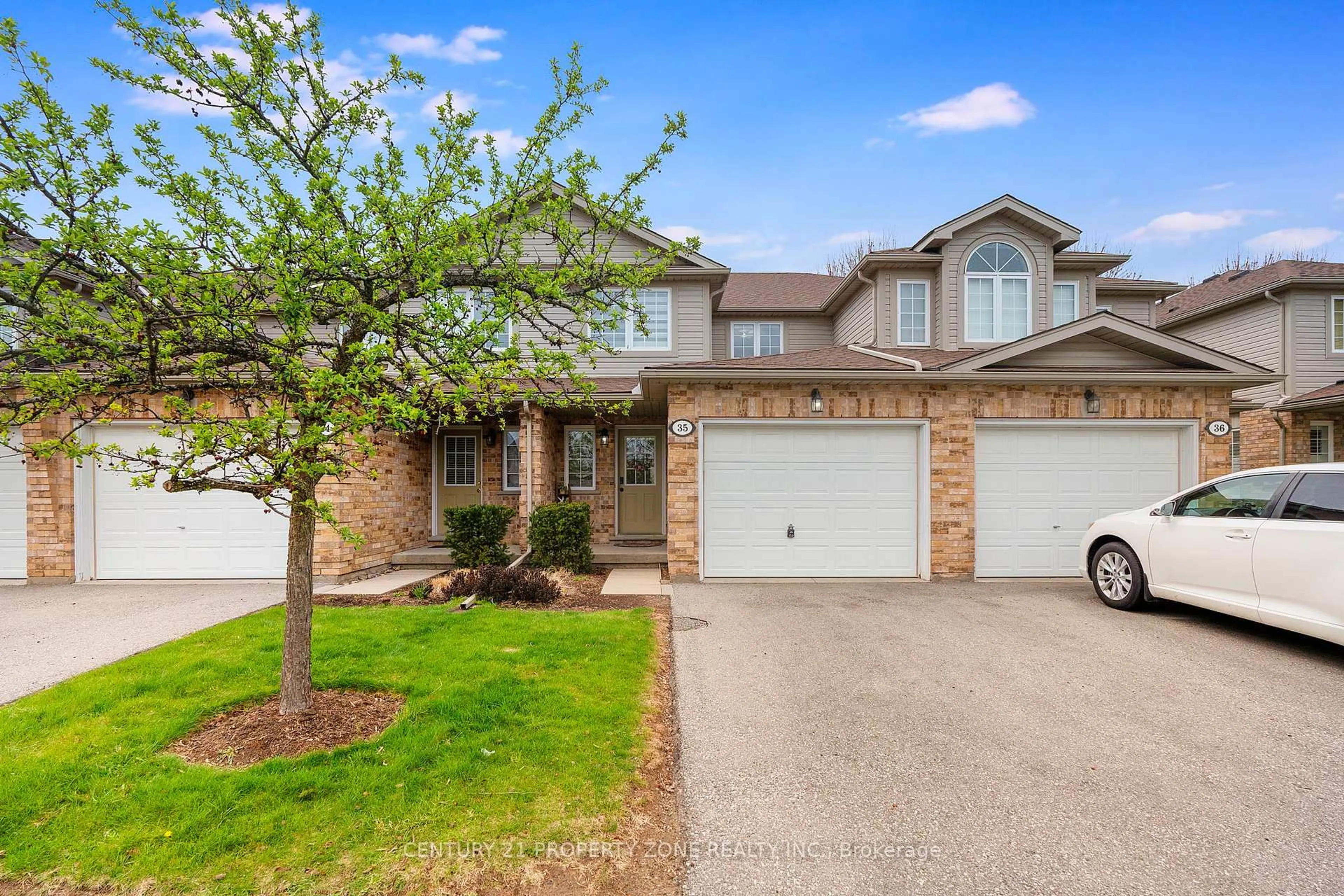 Home with brick exterior material, street for 210 DAWN Ave #35, Guelph Ontario N1G 5L5