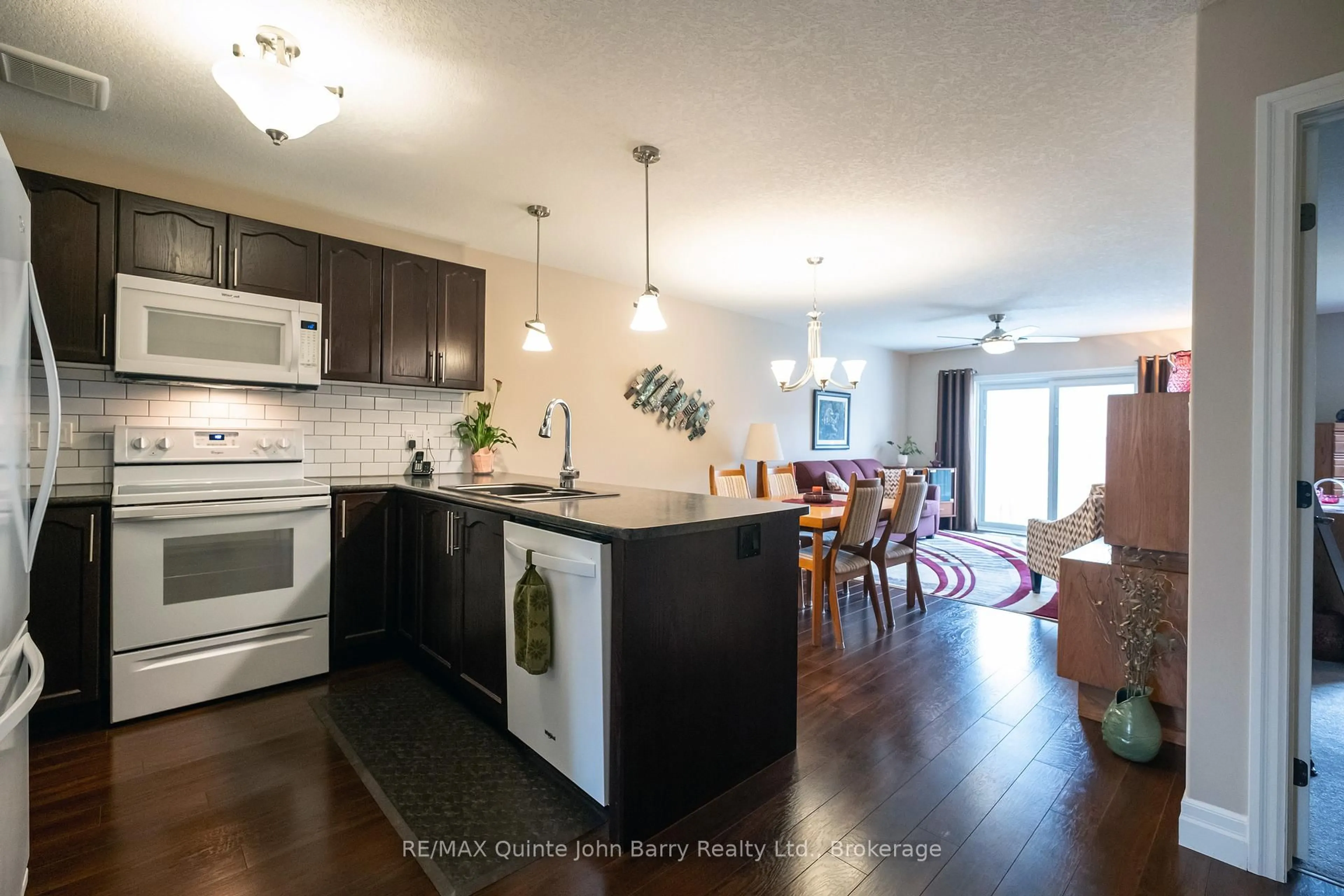 Open concept kitchen, wood/laminate floor for 47 McIntosh Cres, Quinte West Ontario K8V 0G1