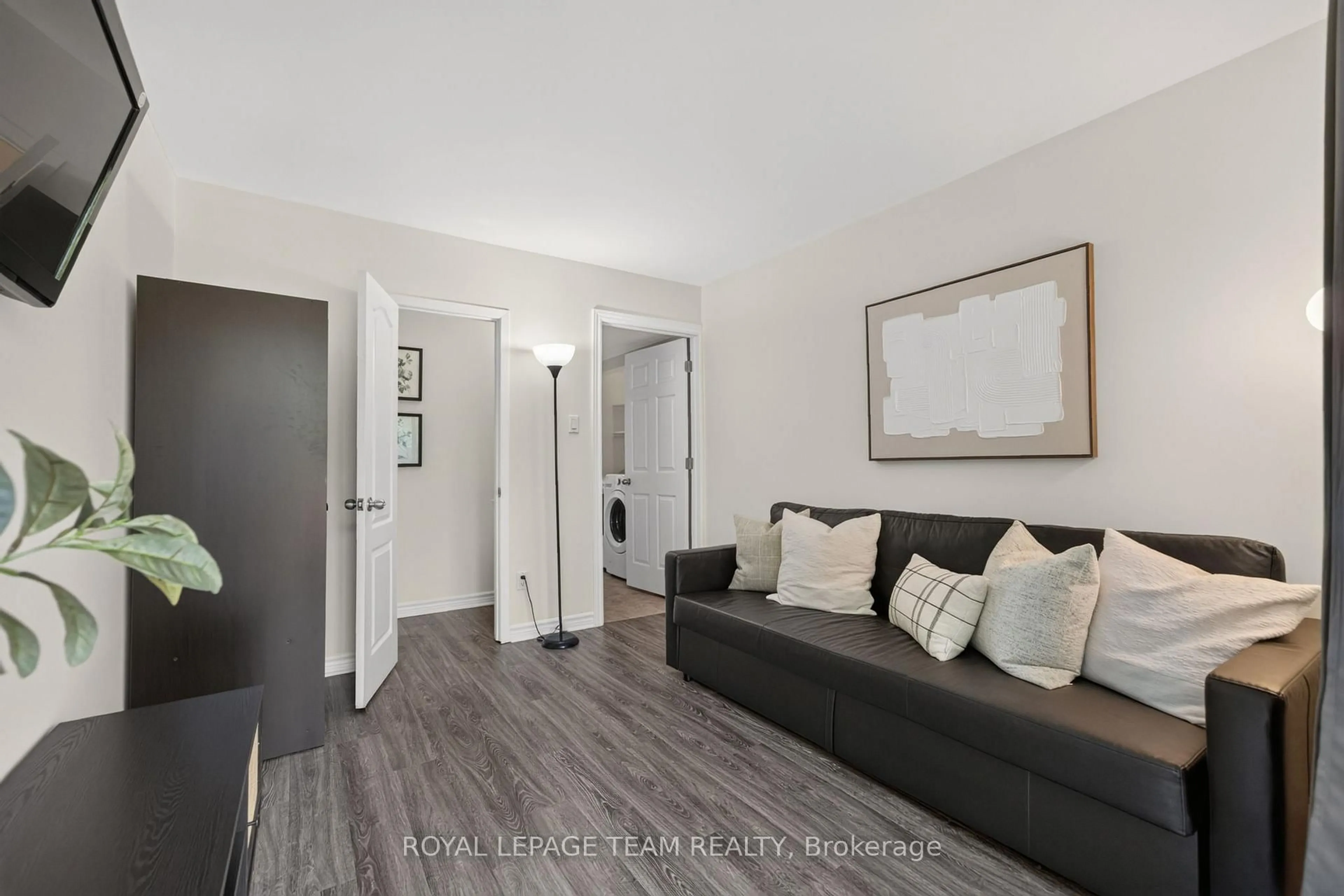 Living room with furniture, wood/laminate floor for 41 Longwood Ave, Ottawa Ontario K2H 6G5