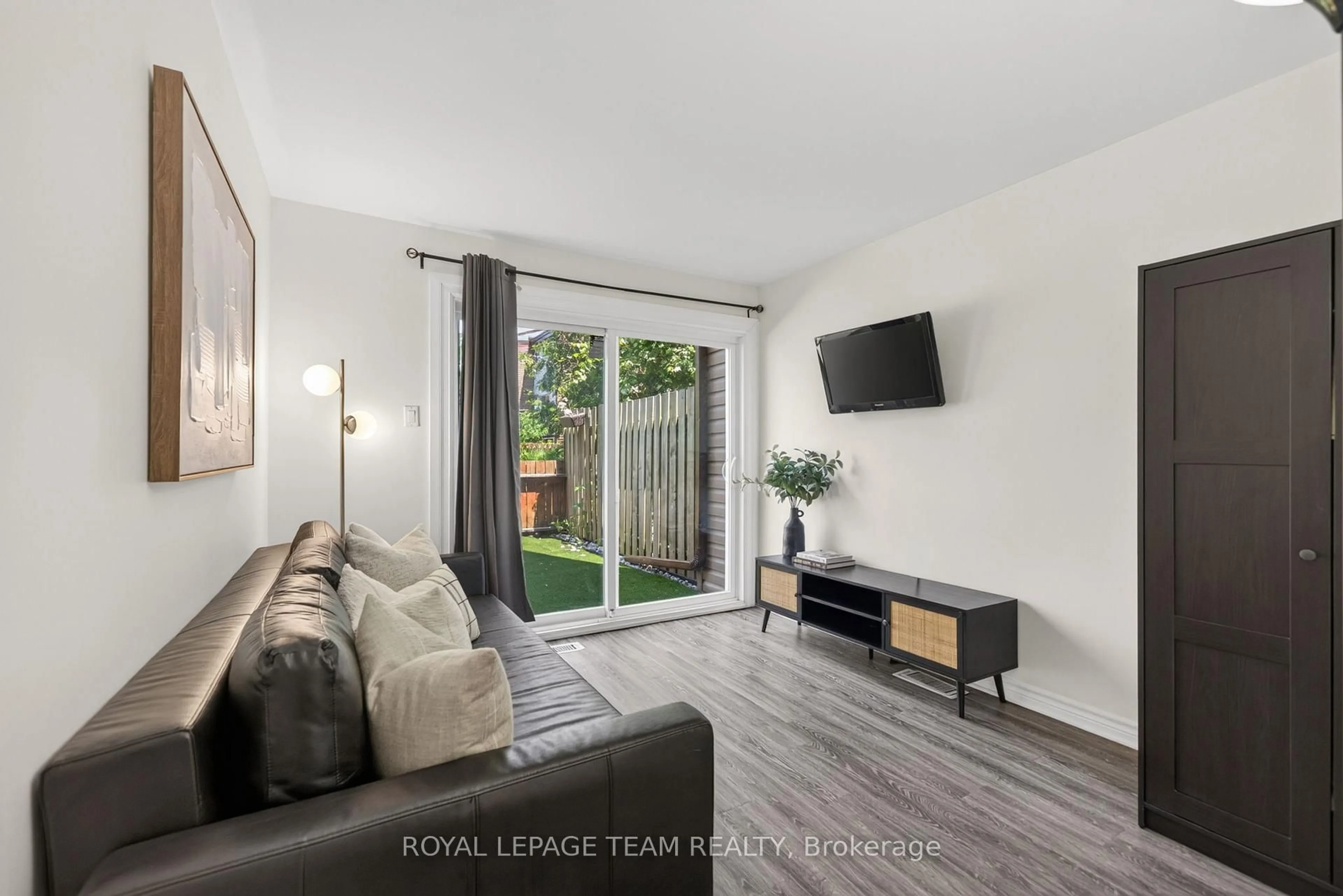 Living room with furniture, wood/laminate floor for 41 Longwood Ave, Ottawa Ontario K2H 6G5