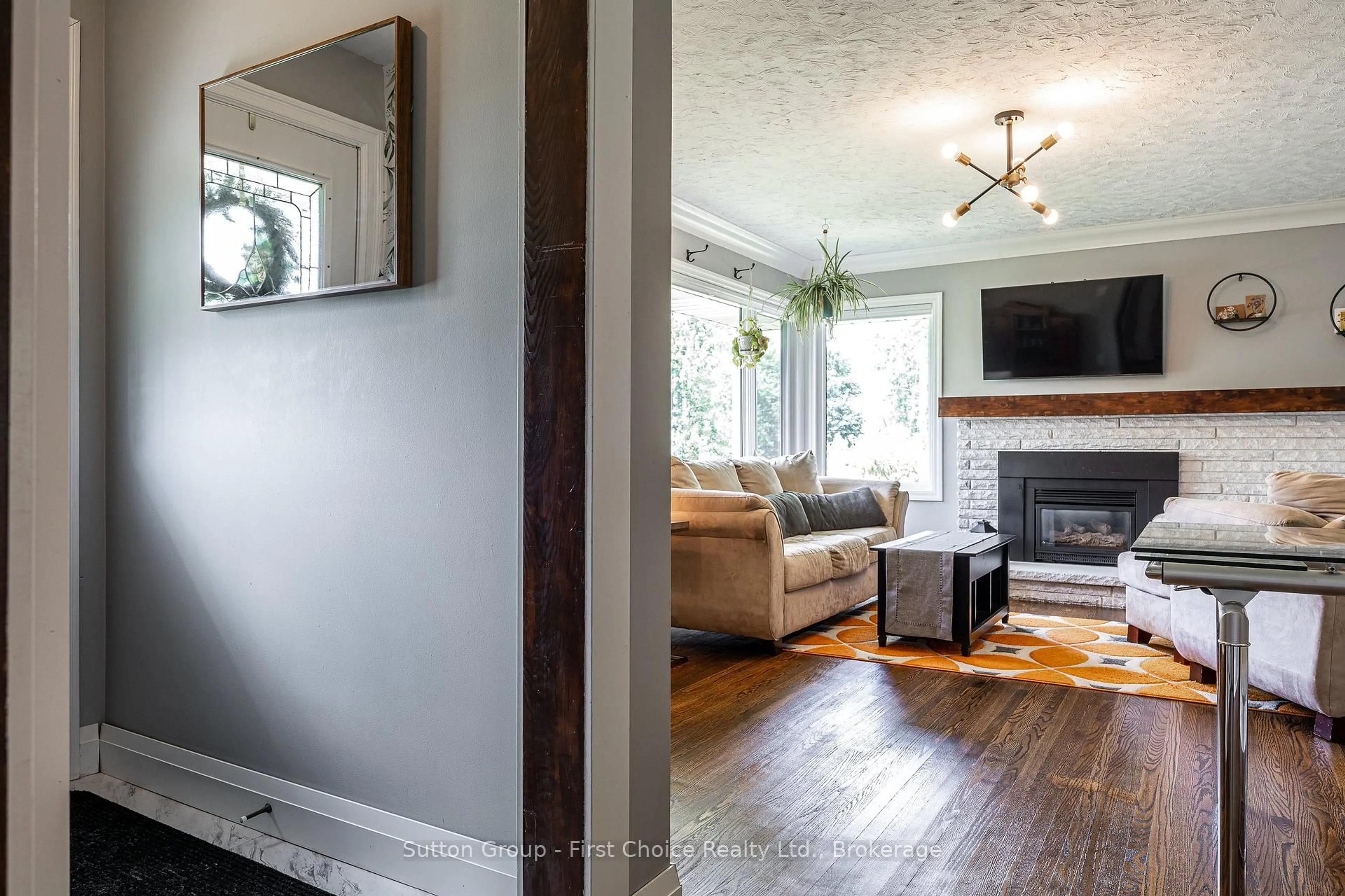 Living room with furniture, wood/laminate floor for 127 Henry St, West Perth Ontario N0K 1N0