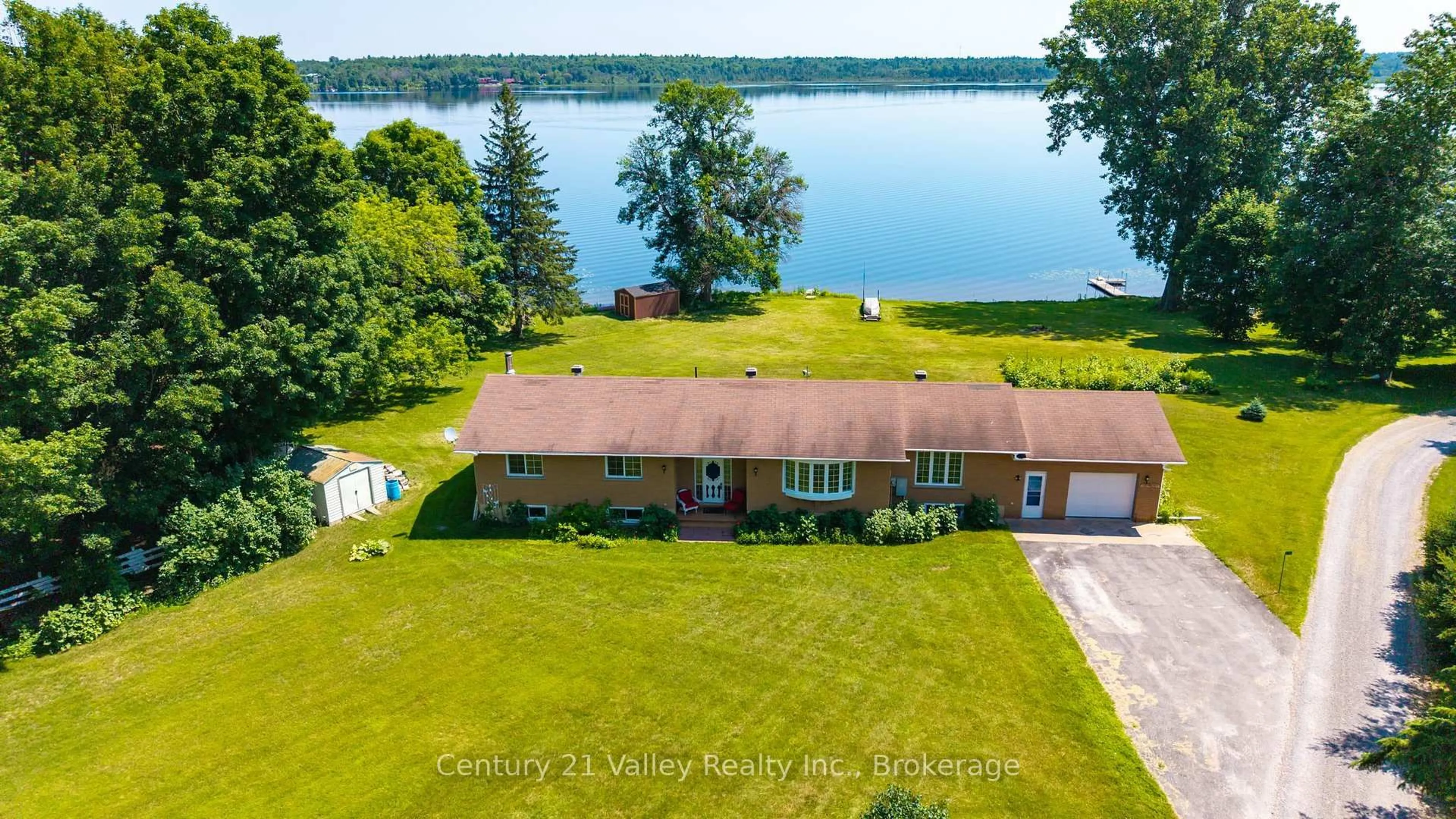 A pic from outside/outdoor area/front of a property/back of a property/a pic from drone, water/lake/river/ocean view for 11 Hart Lane, Calabogie Ontario K0J 1H0