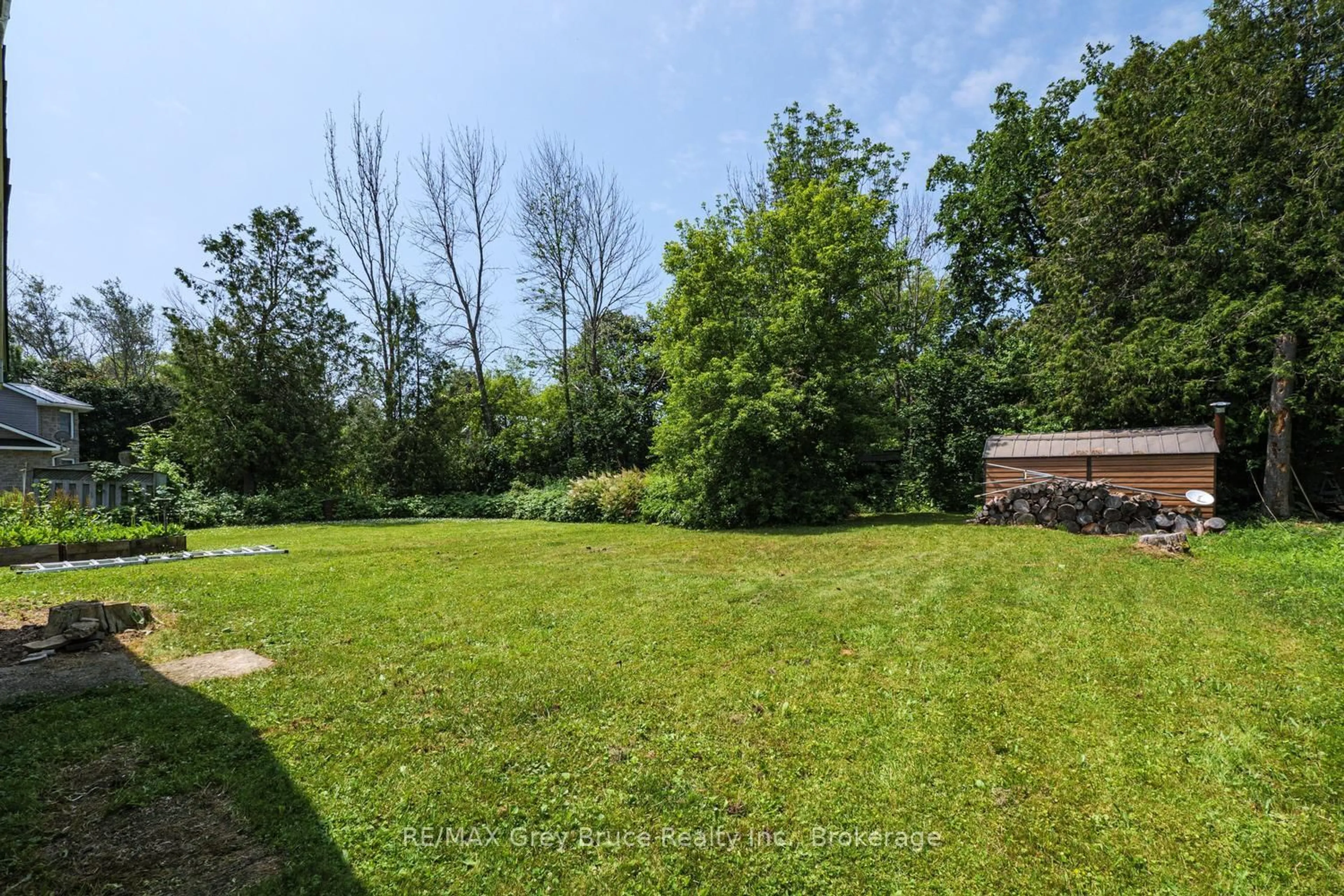 A pic from outside/outdoor area/front of a property/back of a property/a pic from drone, forest/trees view for 586 Dawson St, South Bruce Peninsula Ontario N0H 2T0