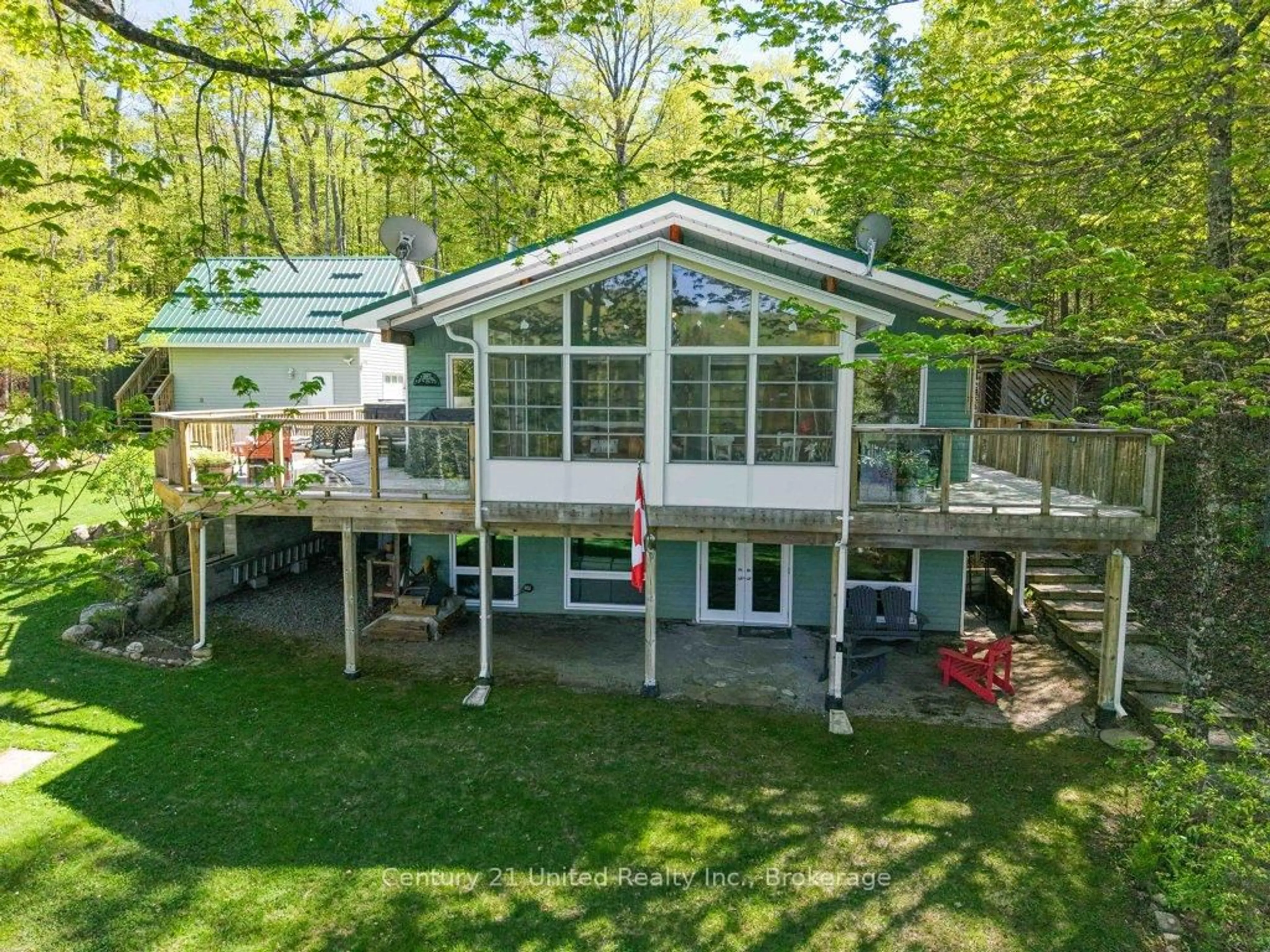 A pic from outside/outdoor area/front of a property/back of a property/a pic from drone, water/lake/river/ocean view for 1120 Surveyor Dr, Highlands East Ontario K0L 2Y0