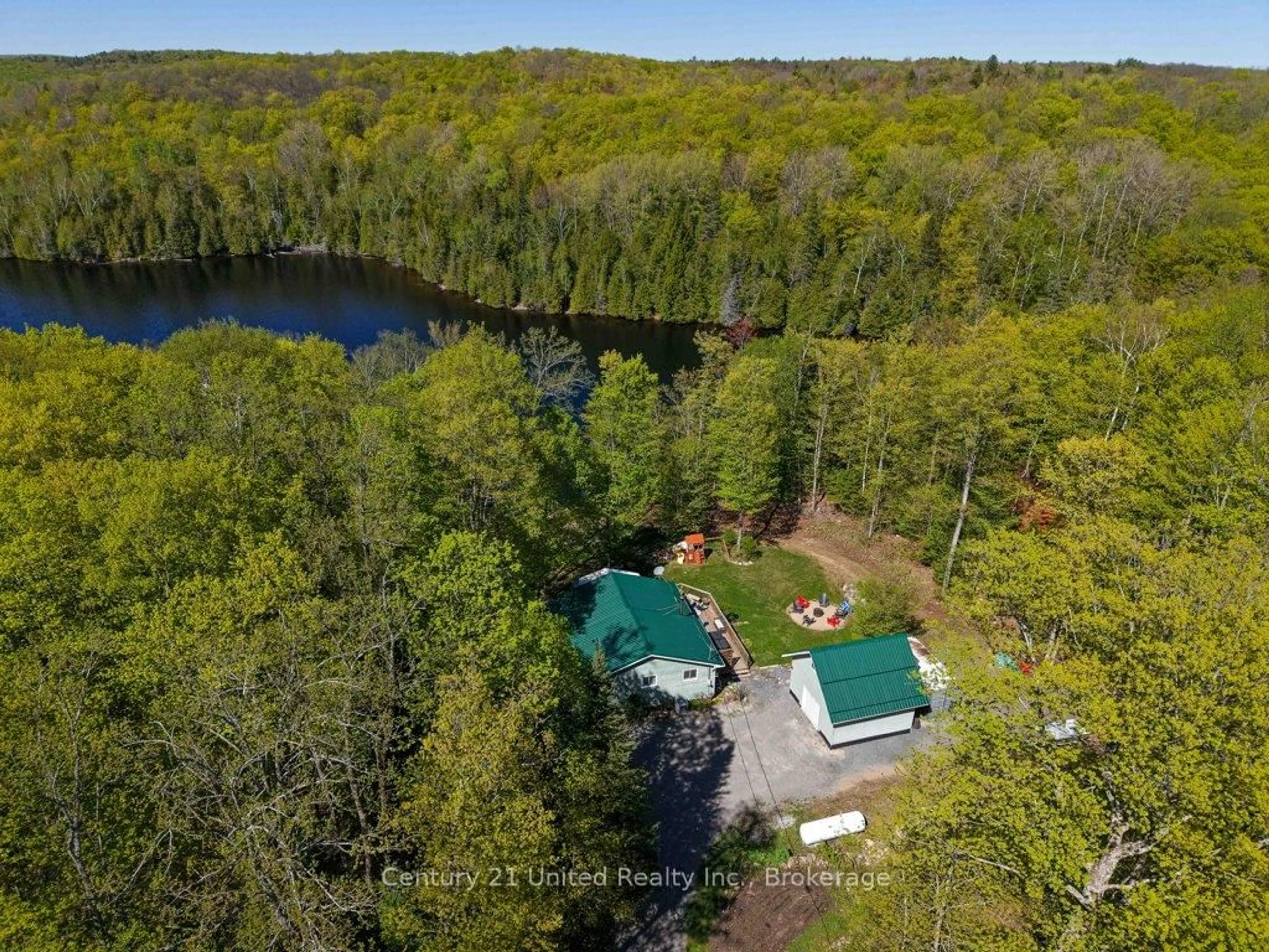 A pic from outside/outdoor area/front of a property/back of a property/a pic from drone, water/lake/river/ocean view for 1120 Surveyor Dr, Highlands East Ontario K0L 2Y0