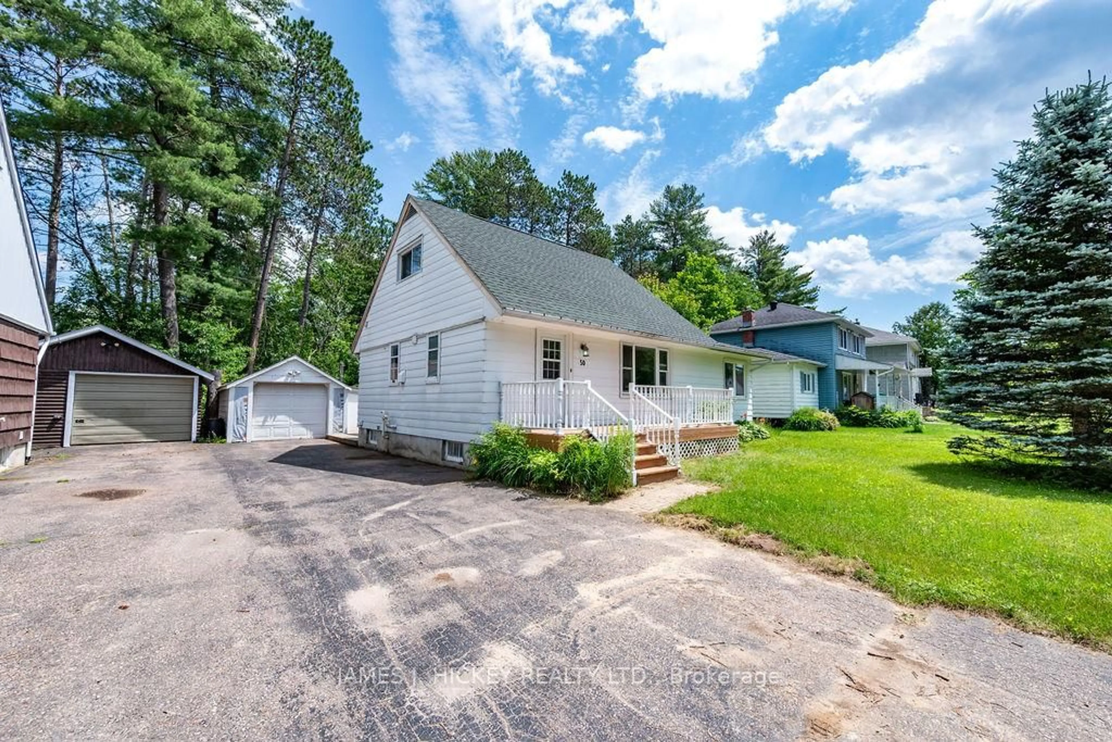 Home with vinyl exterior material, street for 50 Rutherford Ave, Deep River Ontario K0J 1P0