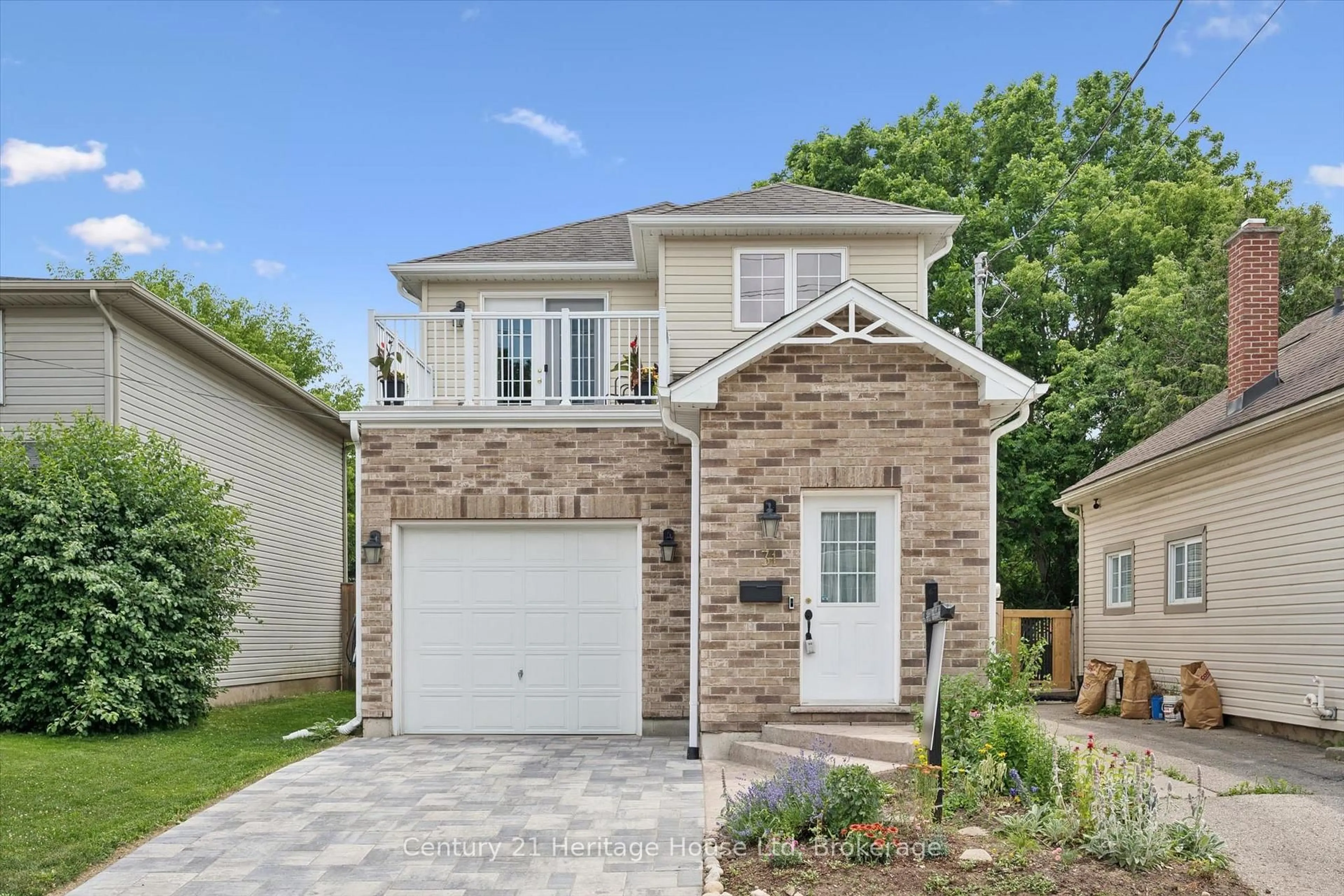 Home with brick exterior material, street for 31 Alice St, Guelph Ontario N1E 2Z7