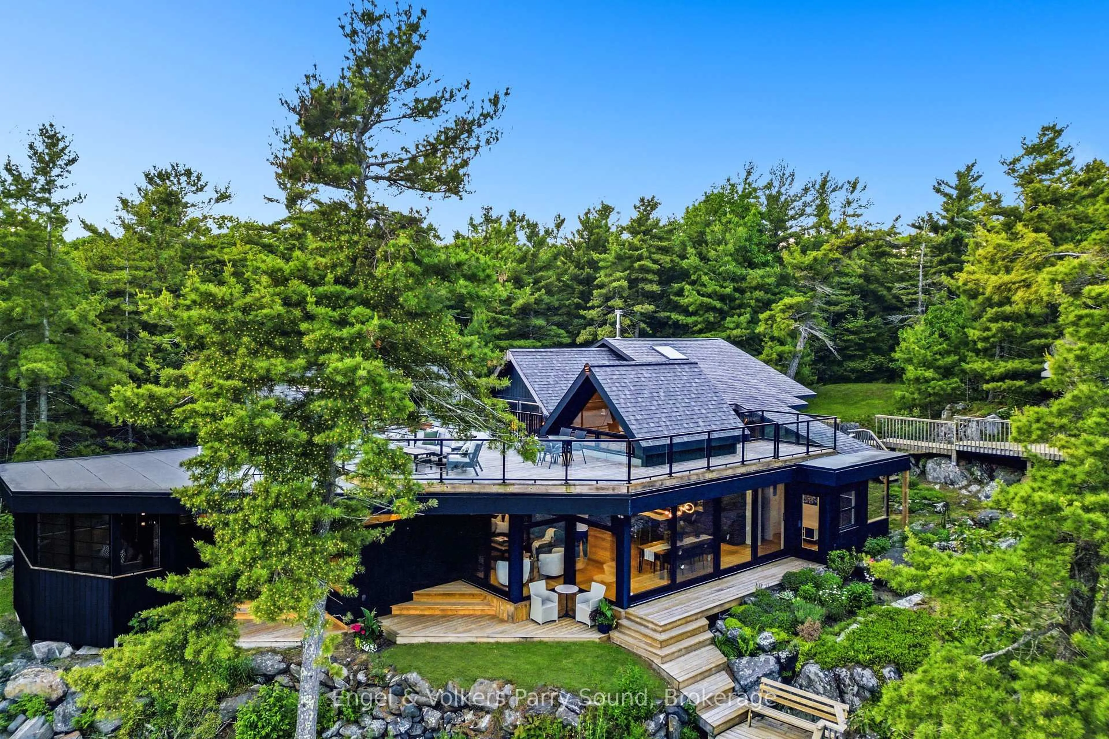 A pic from outside/outdoor area/front of a property/back of a property/a pic from drone, water/lake/river/ocean view for 8 Island 65c (Rose Island), Carling Ontario P0G 1G0