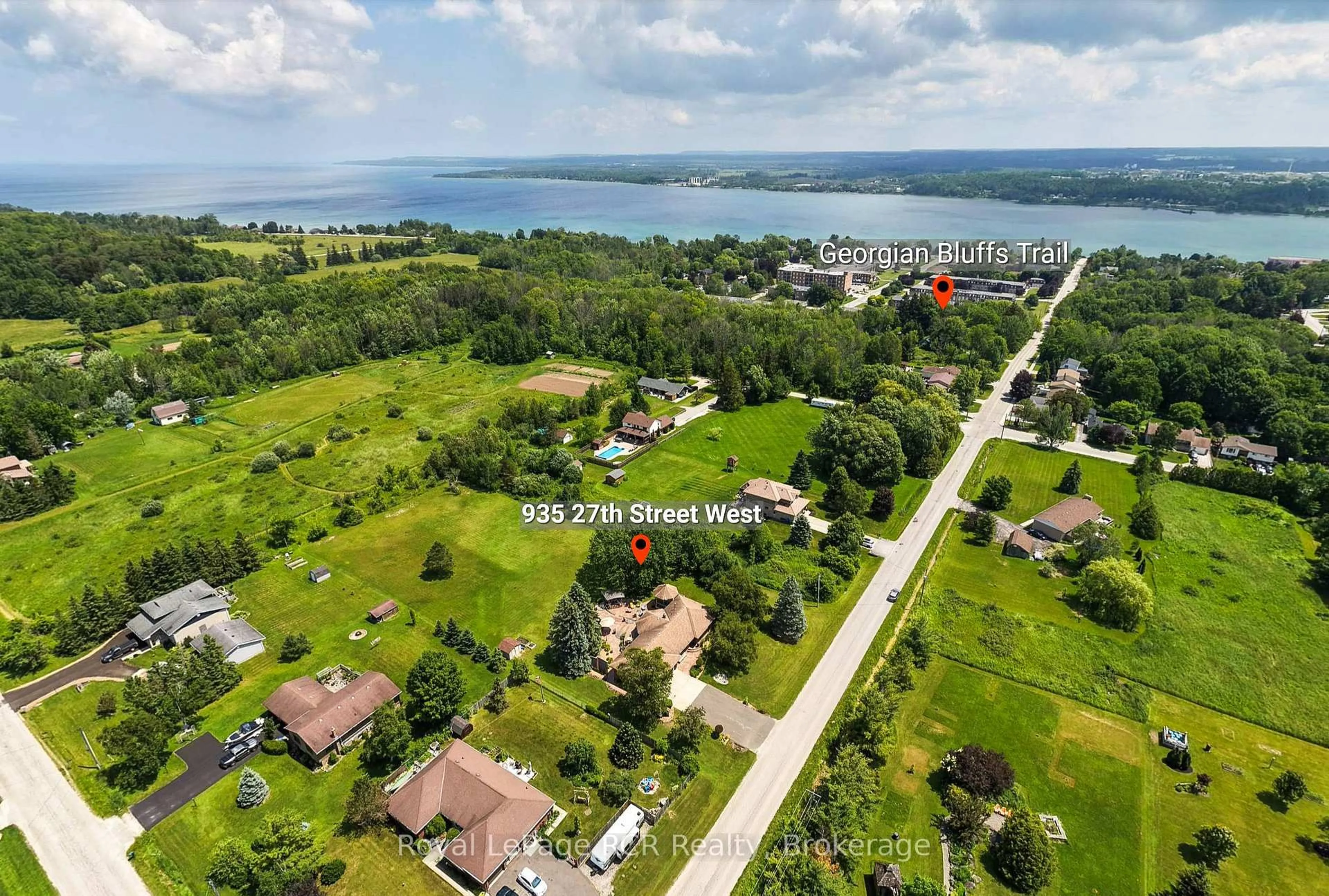 A pic from outside/outdoor area/front of a property/back of a property/a pic from drone, water/lake/river/ocean view for 935 27th St, Georgian Bluffs Ontario N4K 0G3