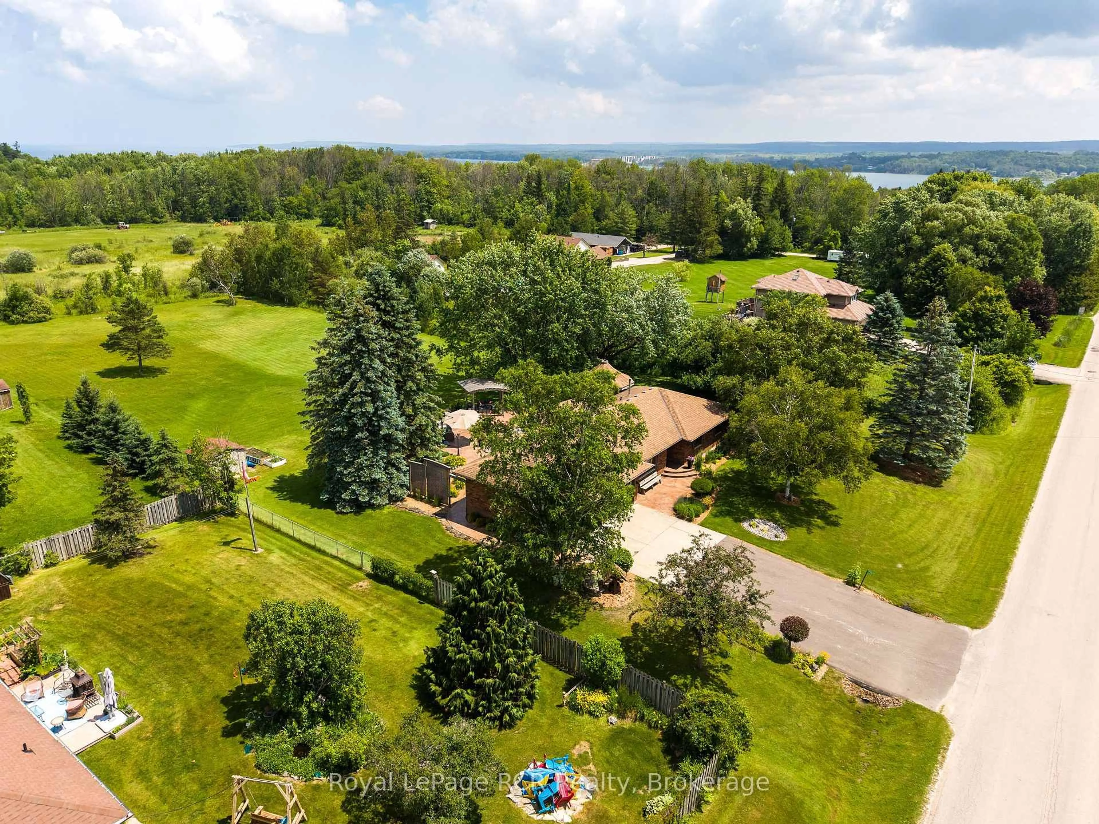 A pic from outside/outdoor area/front of a property/back of a property/a pic from drone, water/lake/river/ocean view for 935 27th St, Georgian Bluffs Ontario N4K 0G3