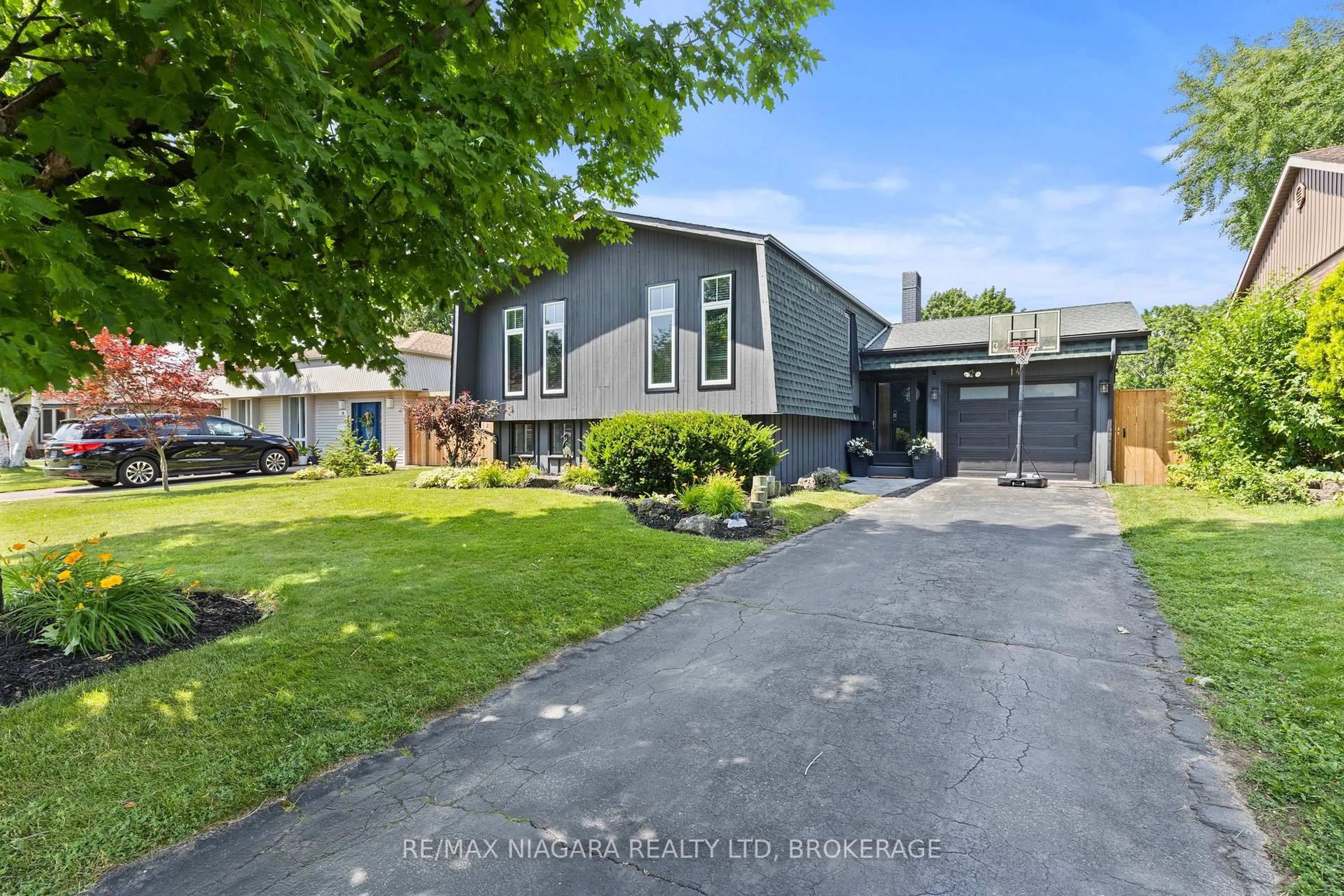 A pic from outside/outdoor area/front of a property/back of a property/a pic from drone, street for 14 The Cedars, St. Catharines Ontario L2M 6M8