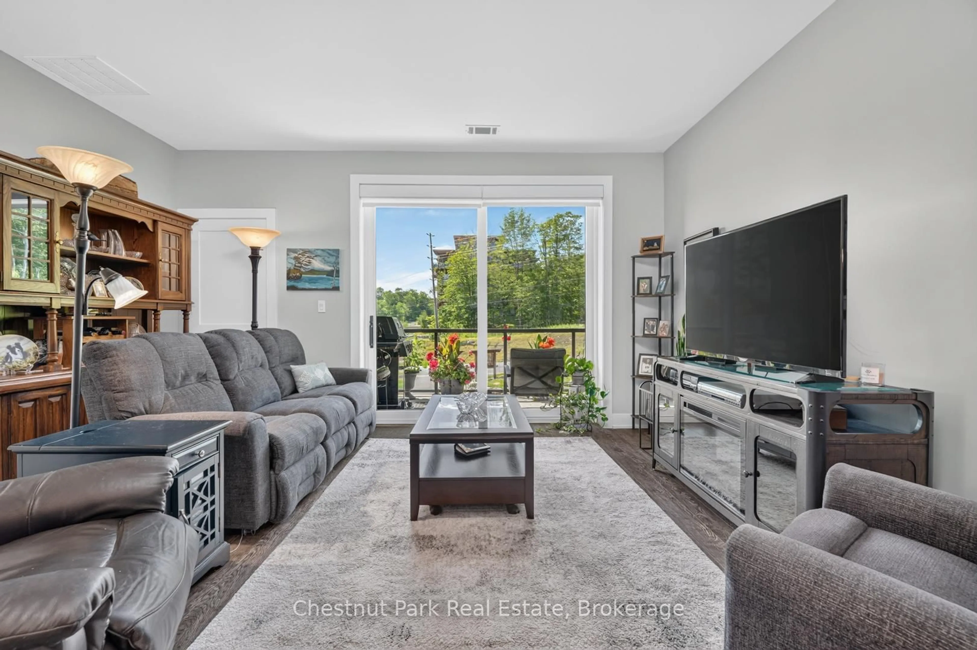 Living room with furniture, unknown for 23 Campus Tr #104, Huntsville Ontario P1H 0G1