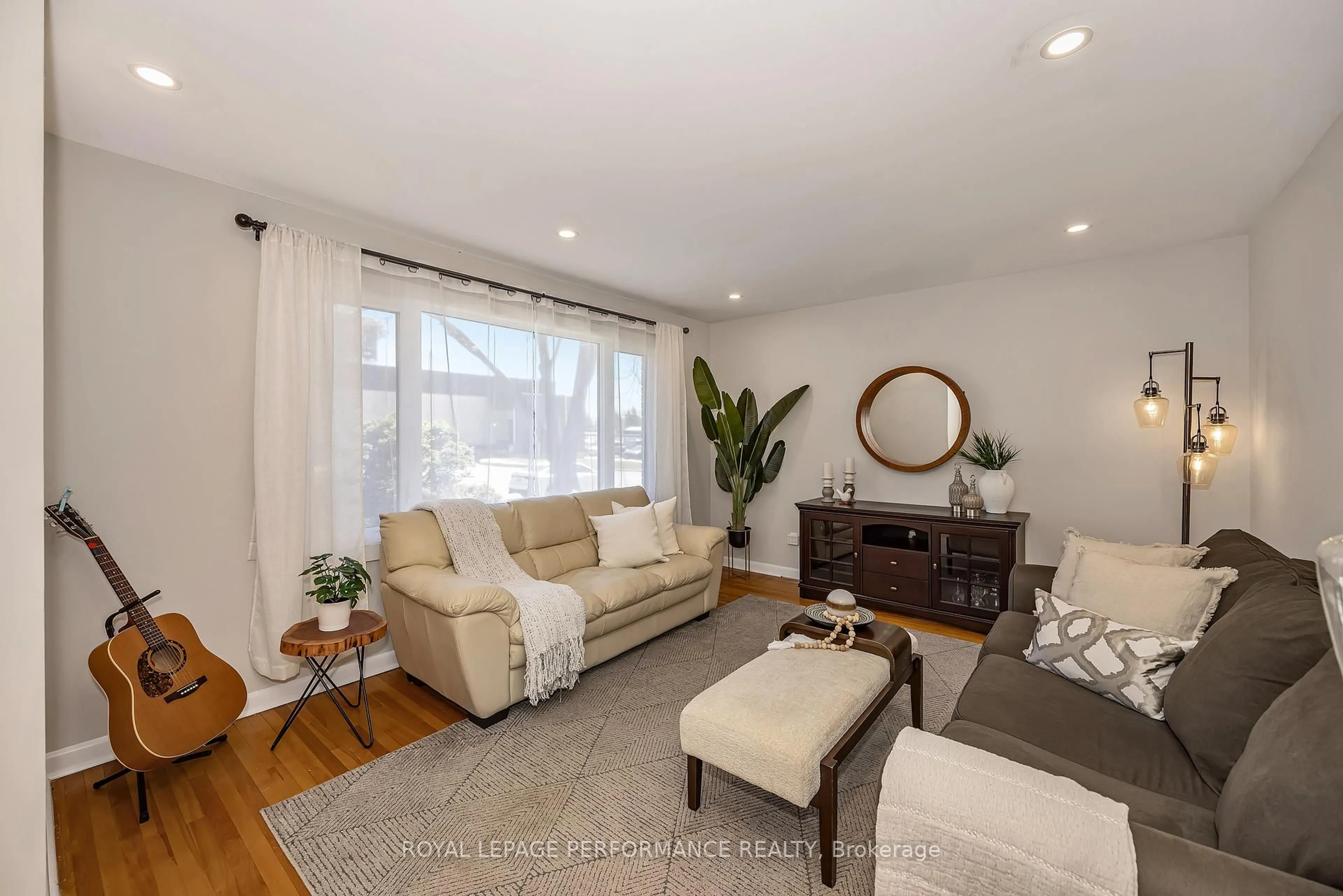Living room with furniture, wood/laminate floor for 1960 Othello Ave, Ottawa Ontario K1G 2A4
